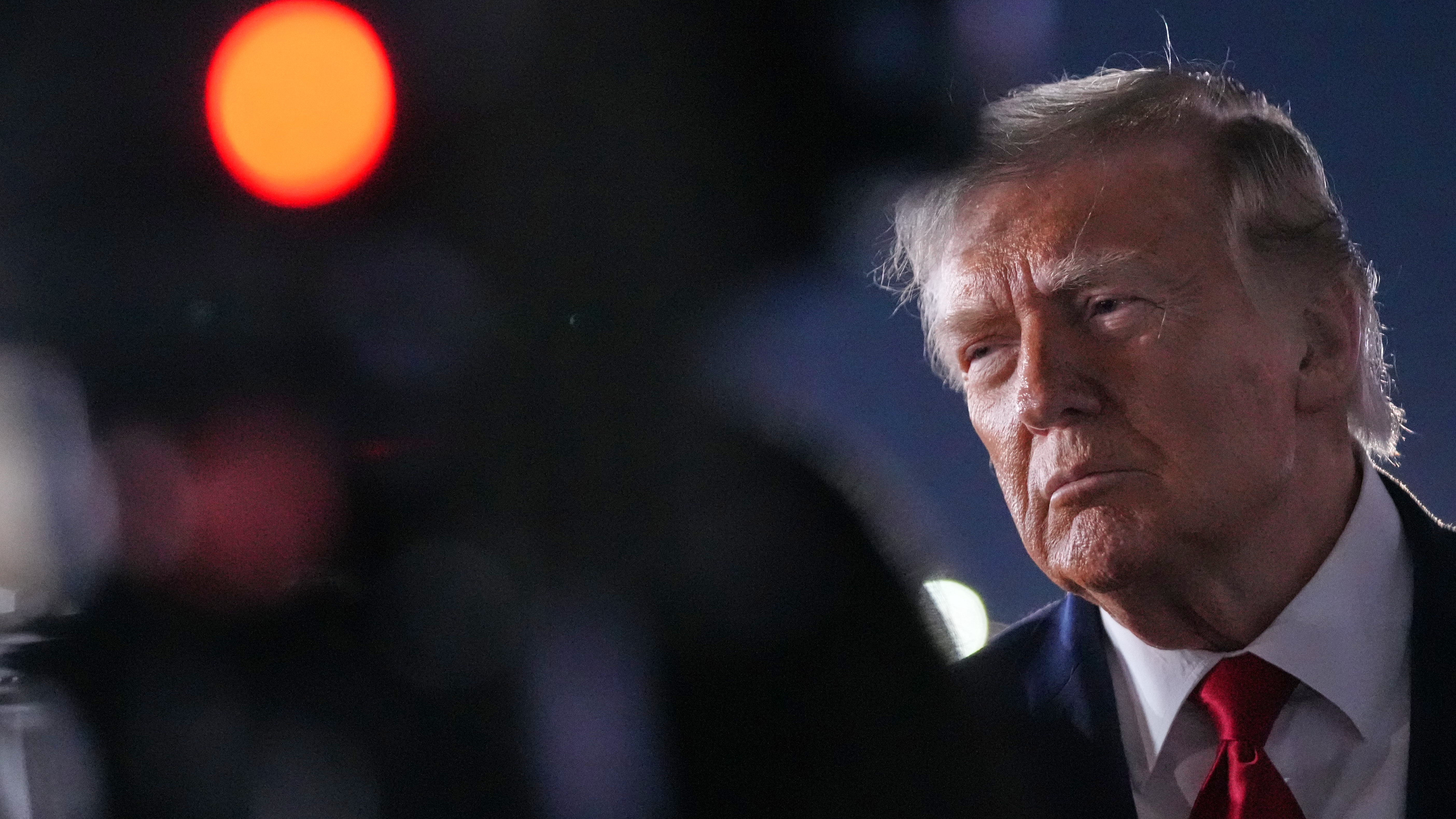 US President Donald Trump talks with reporters before boarding Air Force One at John F. Kennedy International Airport in New York.