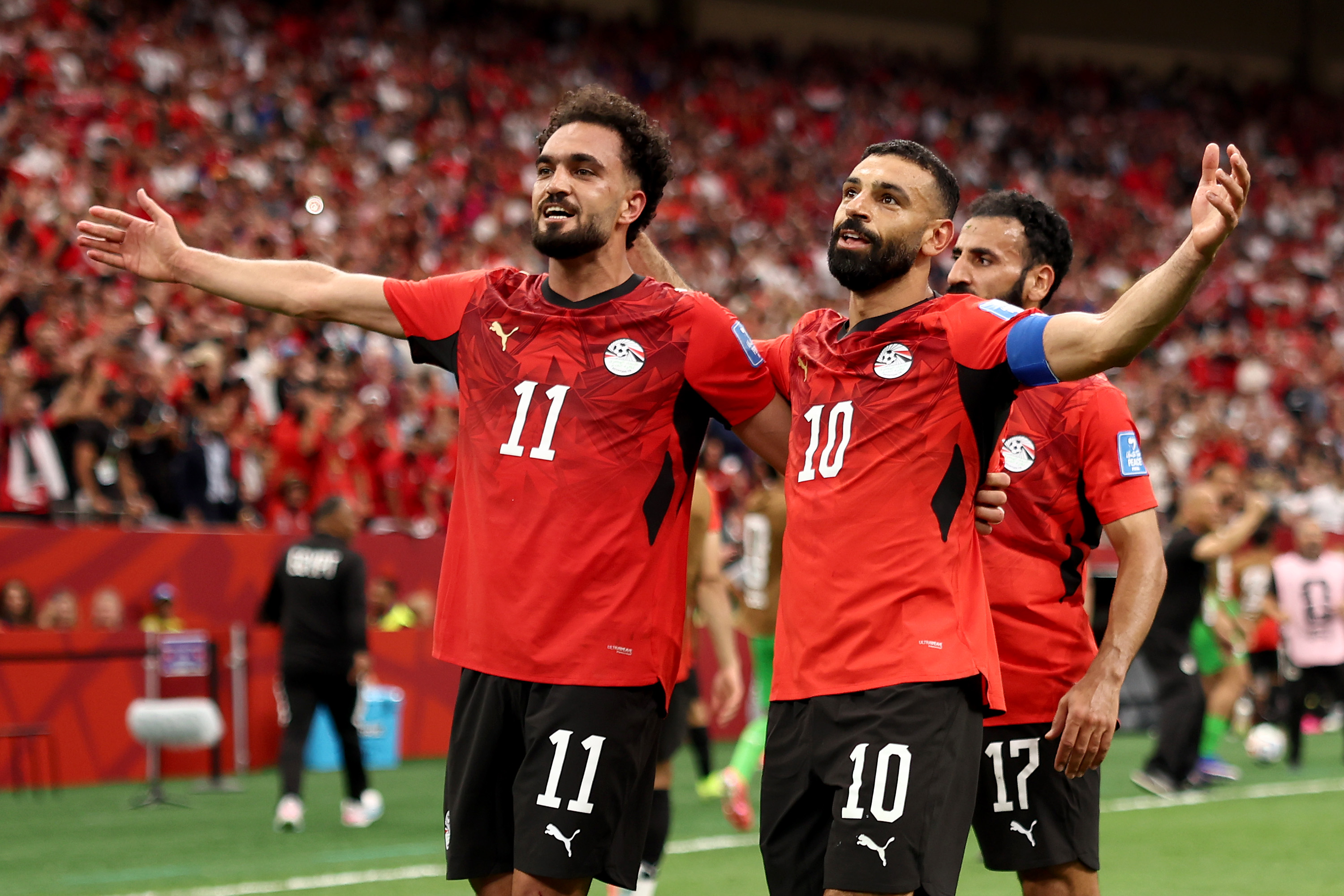 Mohamed Salah (right) celebrates with Mostafa Zico after scoring Egypt's second goal against New Zealand.