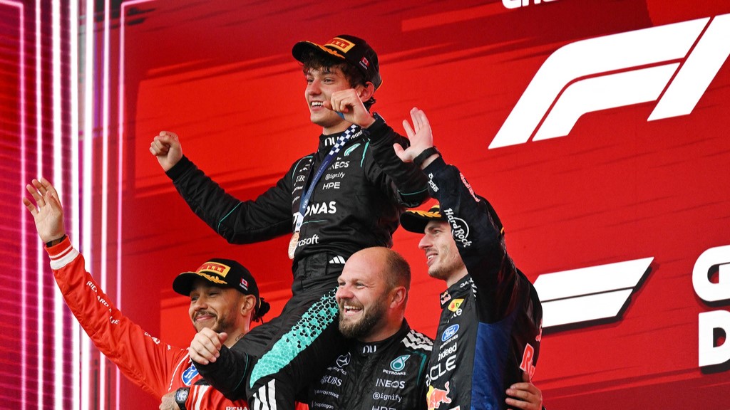 First-place finisher Mercedes driver Kimi Antonelli, top, of Italy, is held aloft by second-place finisher Ferrari driver Lewis Hamilton, left, of Britain, and Mercedes senior composite technician Dean Hale, second from right, as third-place finisher Red Bull Racing driver Max Verstappen, right, of the Netherlands, joins them following the F1 Canadian Grand Prix auto race in Montreal, Sunday, May 24, 2026.