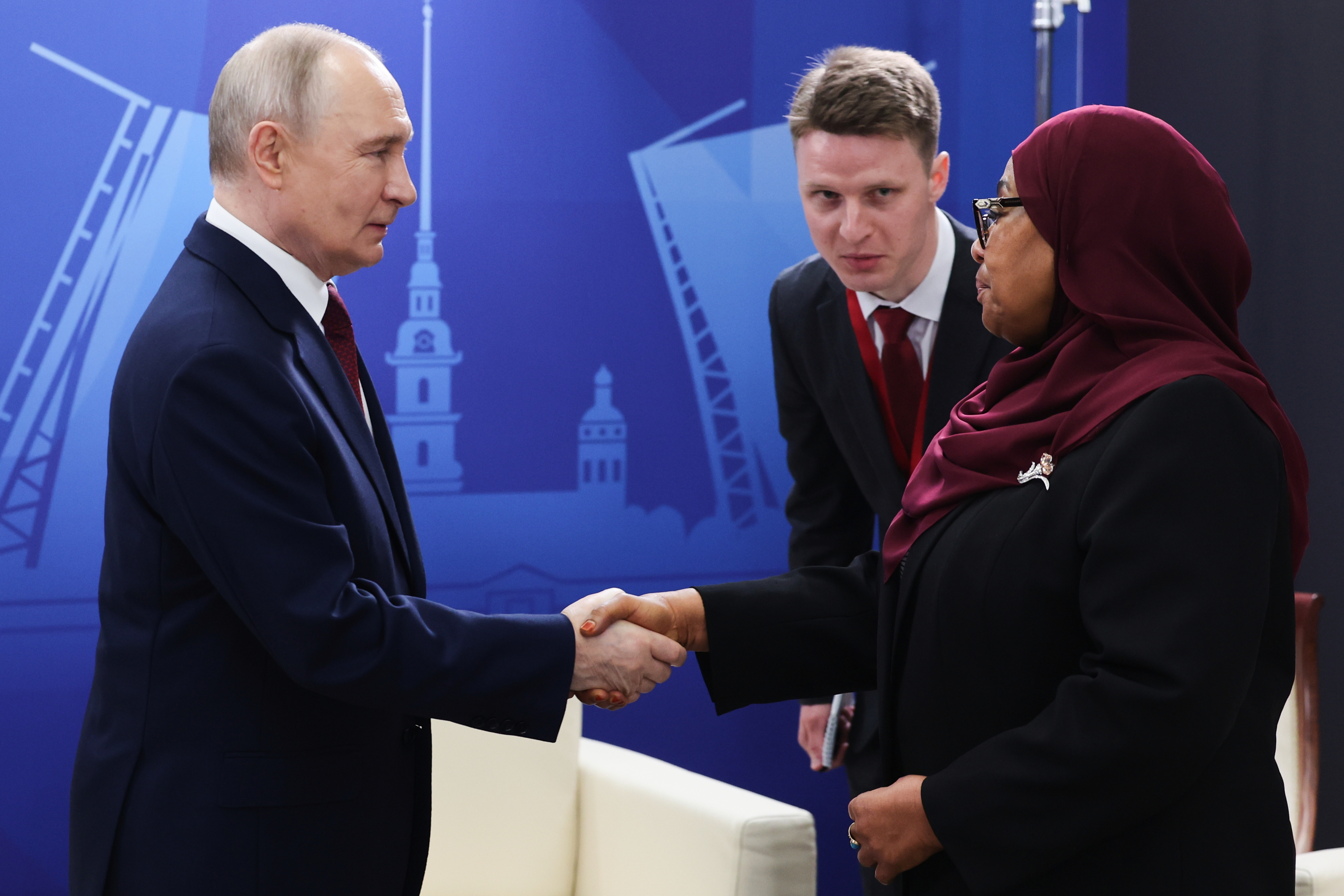 Russian President Vladimir Putin, left, shakes hands with Tanzanian President Samia Suluhu Hassan, prior to a plenary session of the St. Petersburg International Economic Forum in St. Petersburg, Russia, on Friday, June 5, 2026.