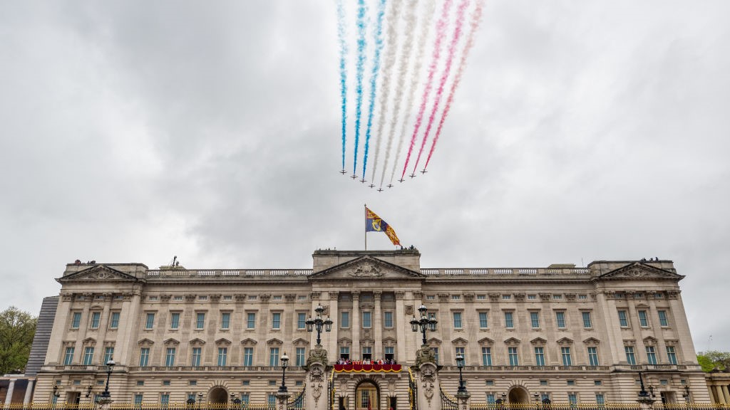 The Red Arrows fly over Buckingham Palace during the Coronation of King Charles III and Queen Camilla.