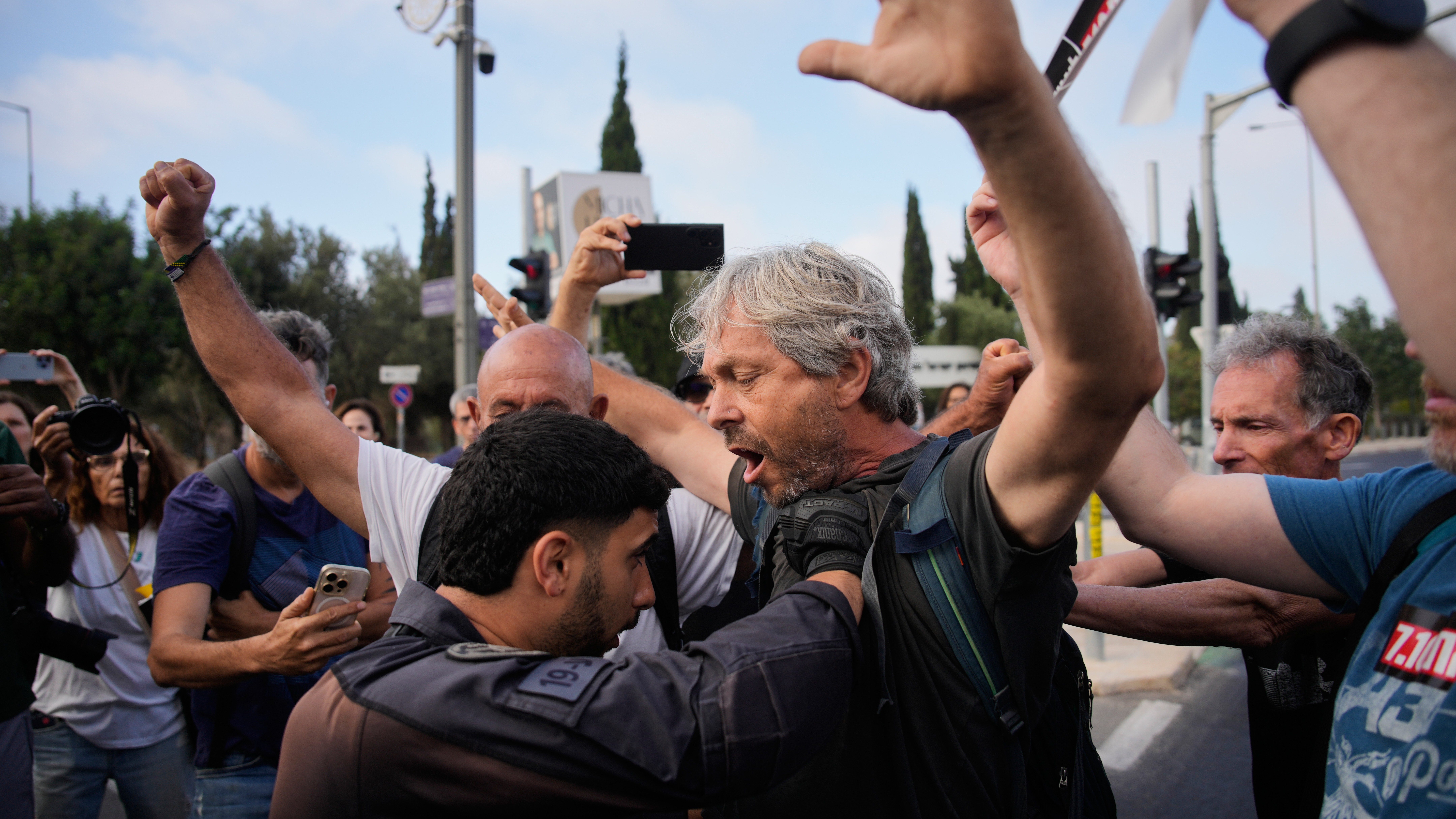 Police disperse demonstrators during a protest marking 1,000 days since the Oct. 7 2003 Hamas-led attack on Israel, outside of the Knesset, Israel's parliament, in Jerusalem, Thursday, July 2, 2026.