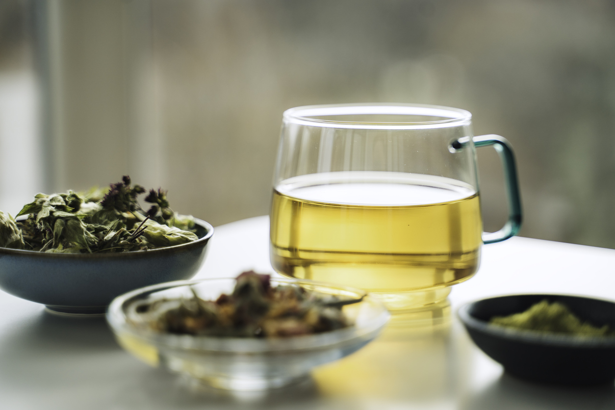 A cup of tea with dry fruit, flowers, and herbs (File image).