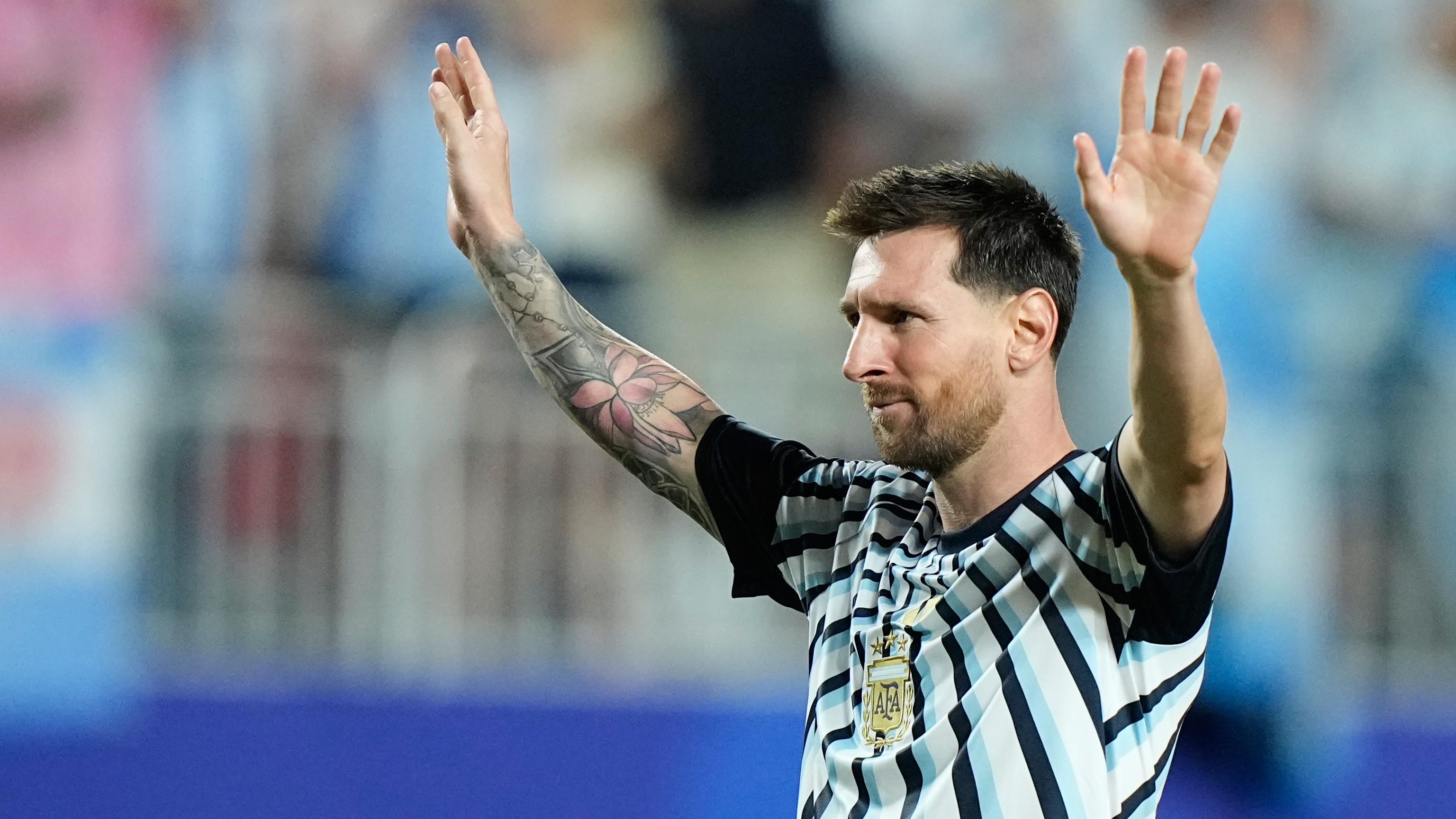 Argentina's Lionel Messi gestures to fans following the World Cup Group J soccer match between Argentina and Algeria in Kansas City.