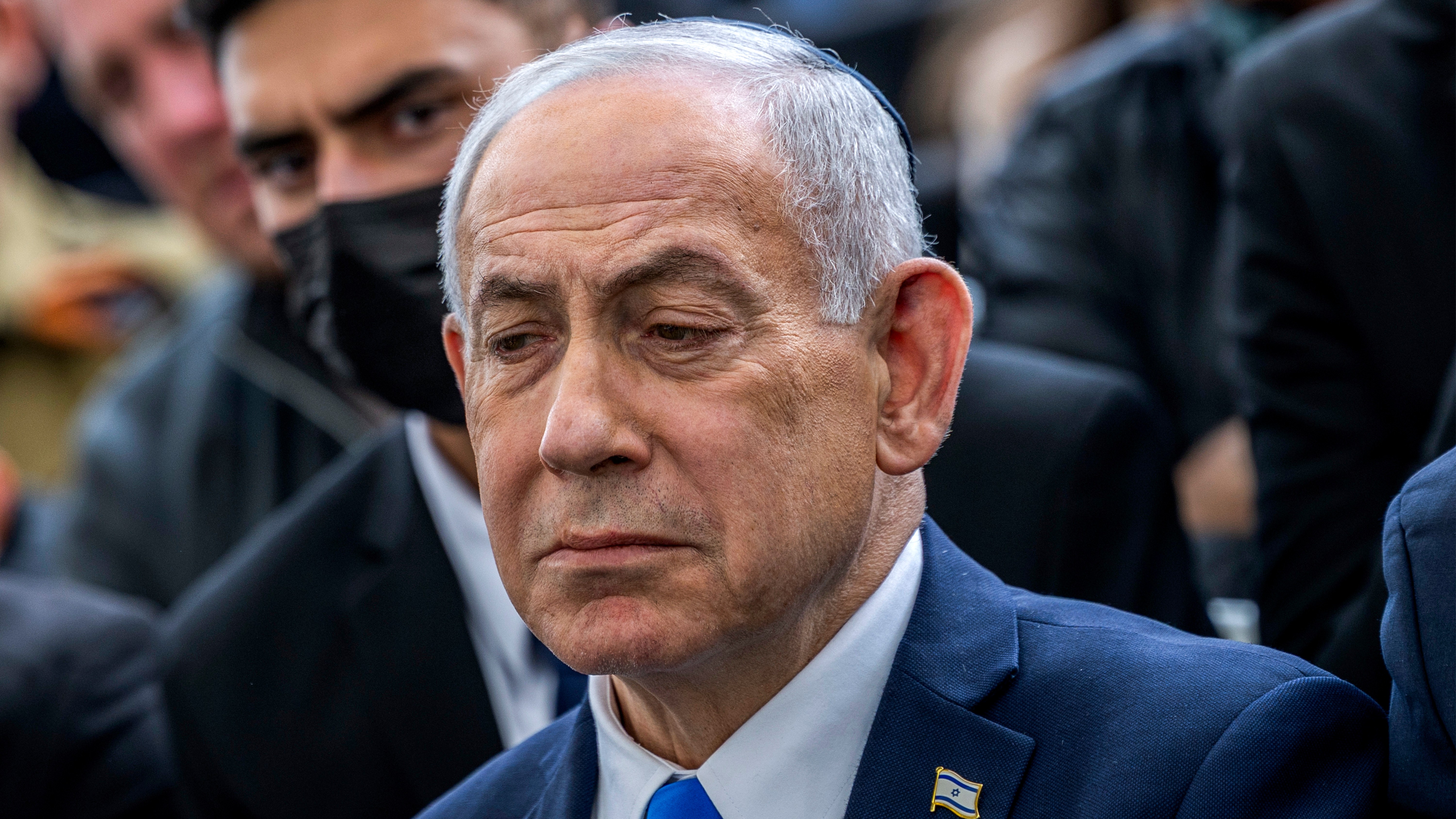 Israel's Prime Minister Benjamin Netanyahu reacts during the funeral of Israeli hostage Ran Gvili, whose remains were brought back to Israel.