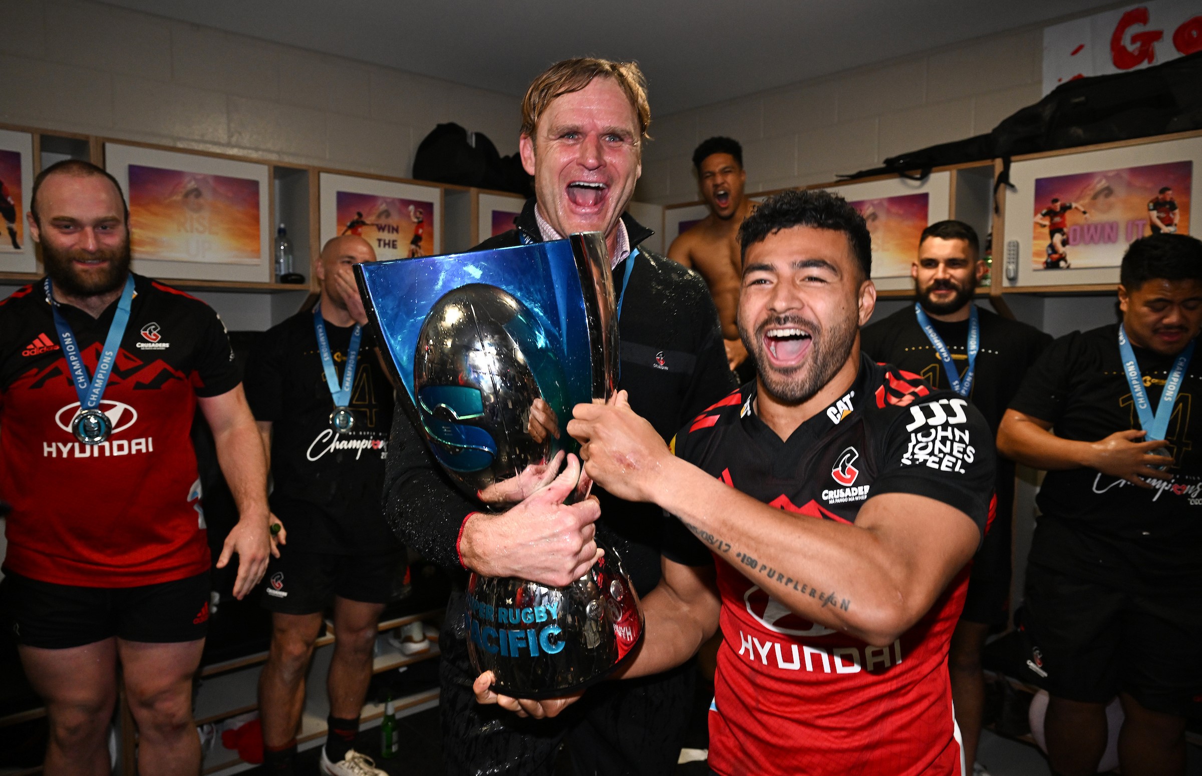 Scott Robertson and Richie Mo'unga celebrate beating the Chiefs in the 2023 Super Rugby grand final.