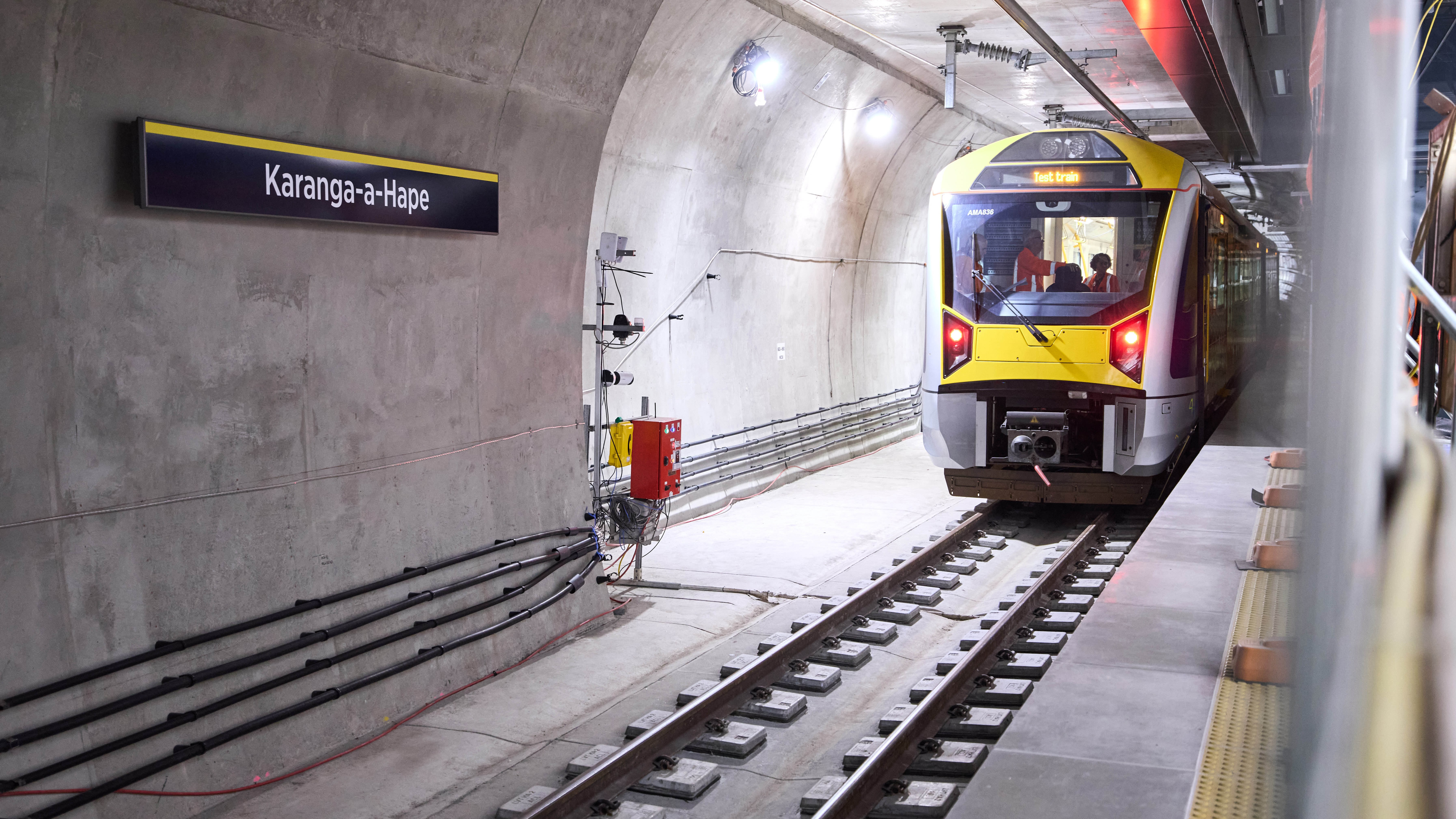 The first test train travels through Auckland's City Rail Link at Karanga-a-Hape station.