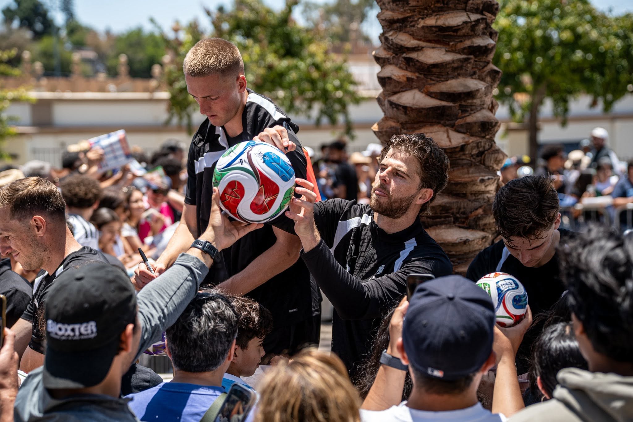 San Diego locals greet the All Whites as they arrive at their training base.