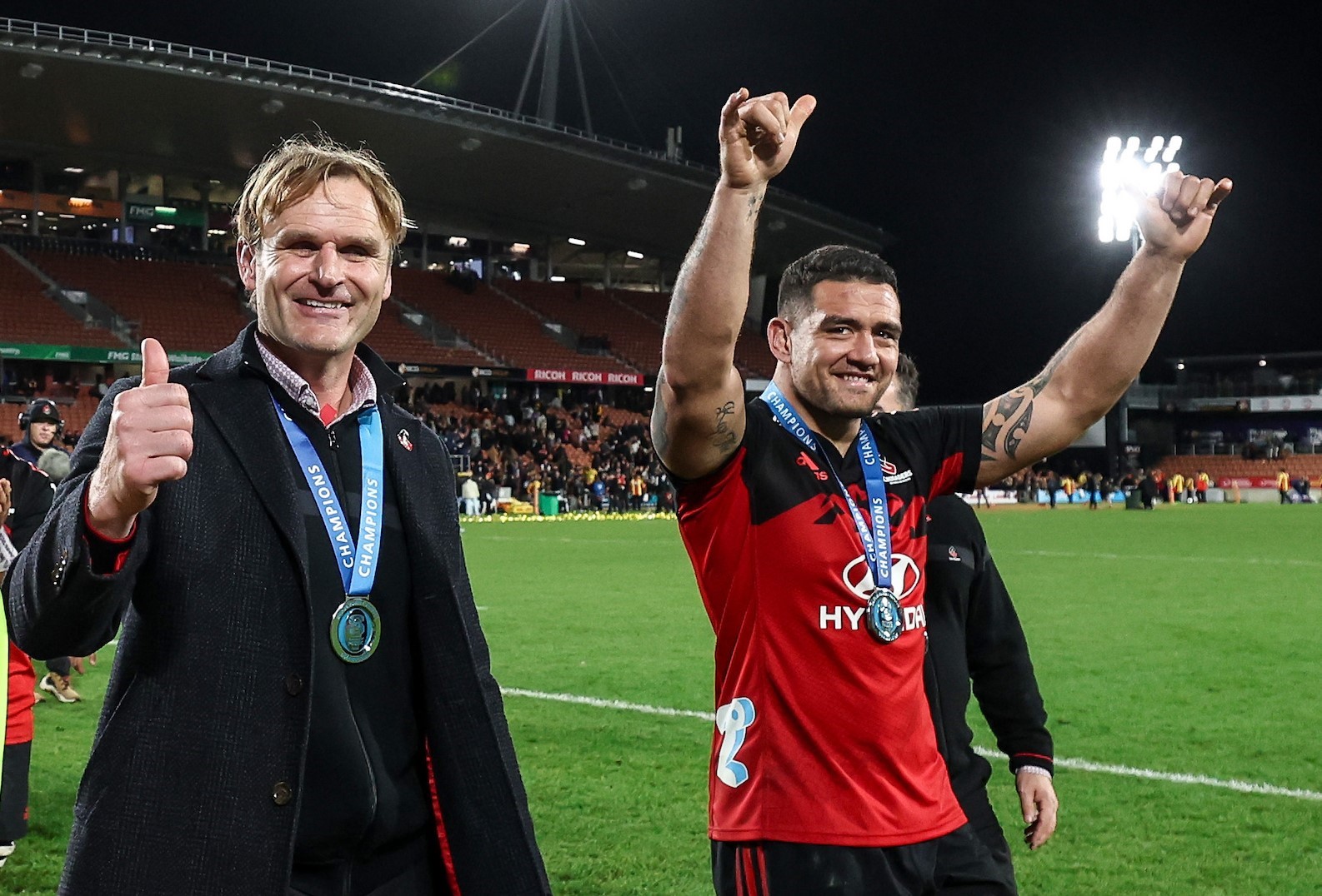 Scott Robertson and Codie Taylor celebrate the Crusaders' Super Rugby grand final victory over the Chiefs at Waikato Stadium in 2023.