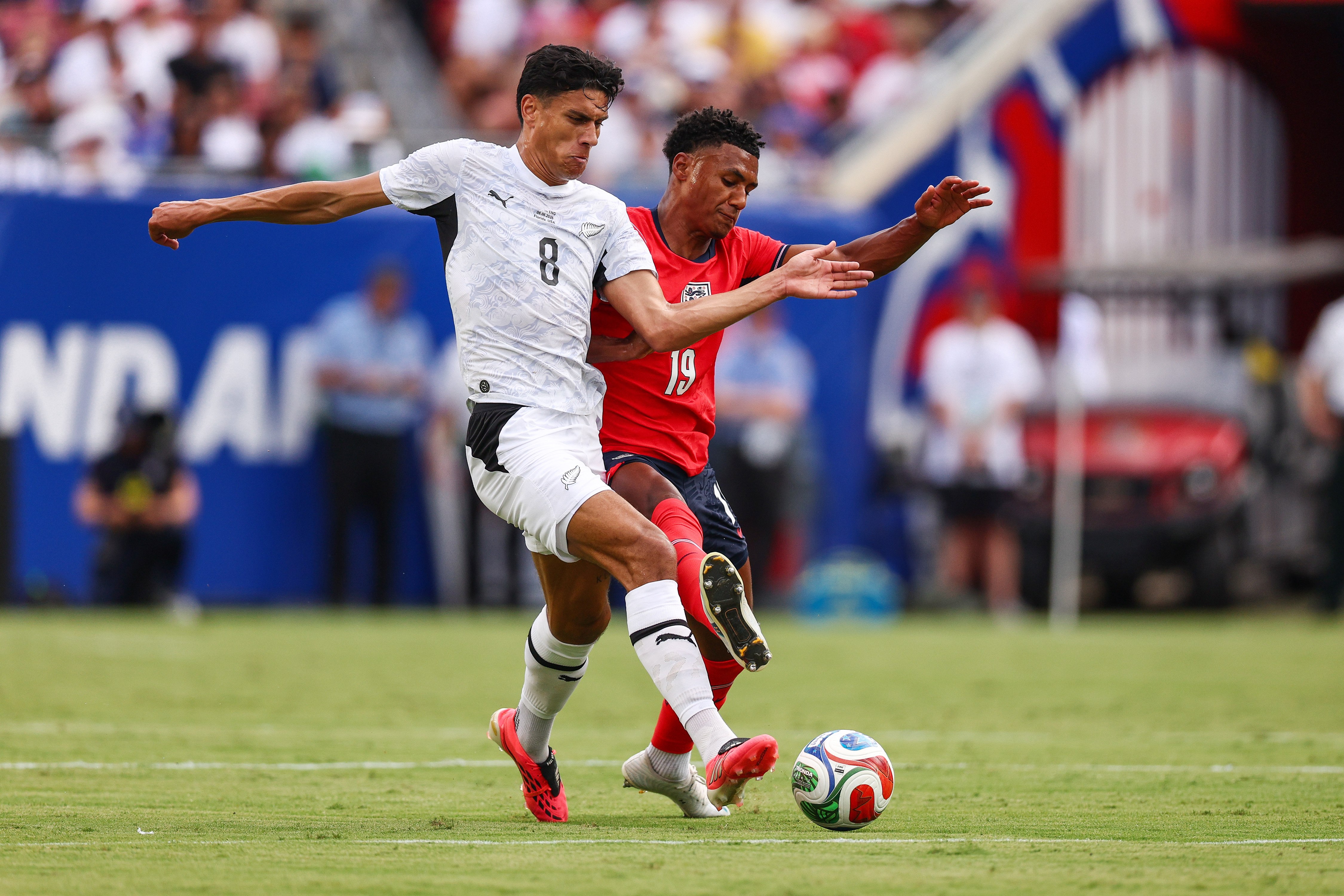 All Whites Marko Stamenic fights for the ball against Ollie Watkins of England.