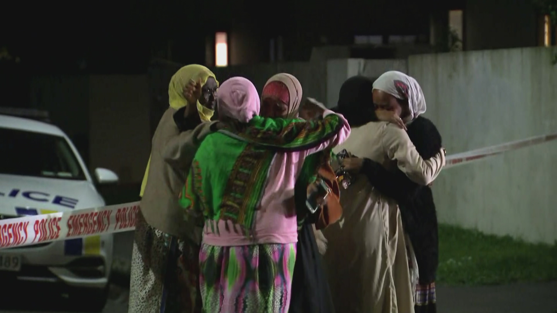Families embrace in Christchurch following the March 15, 2019 terrorist attack.