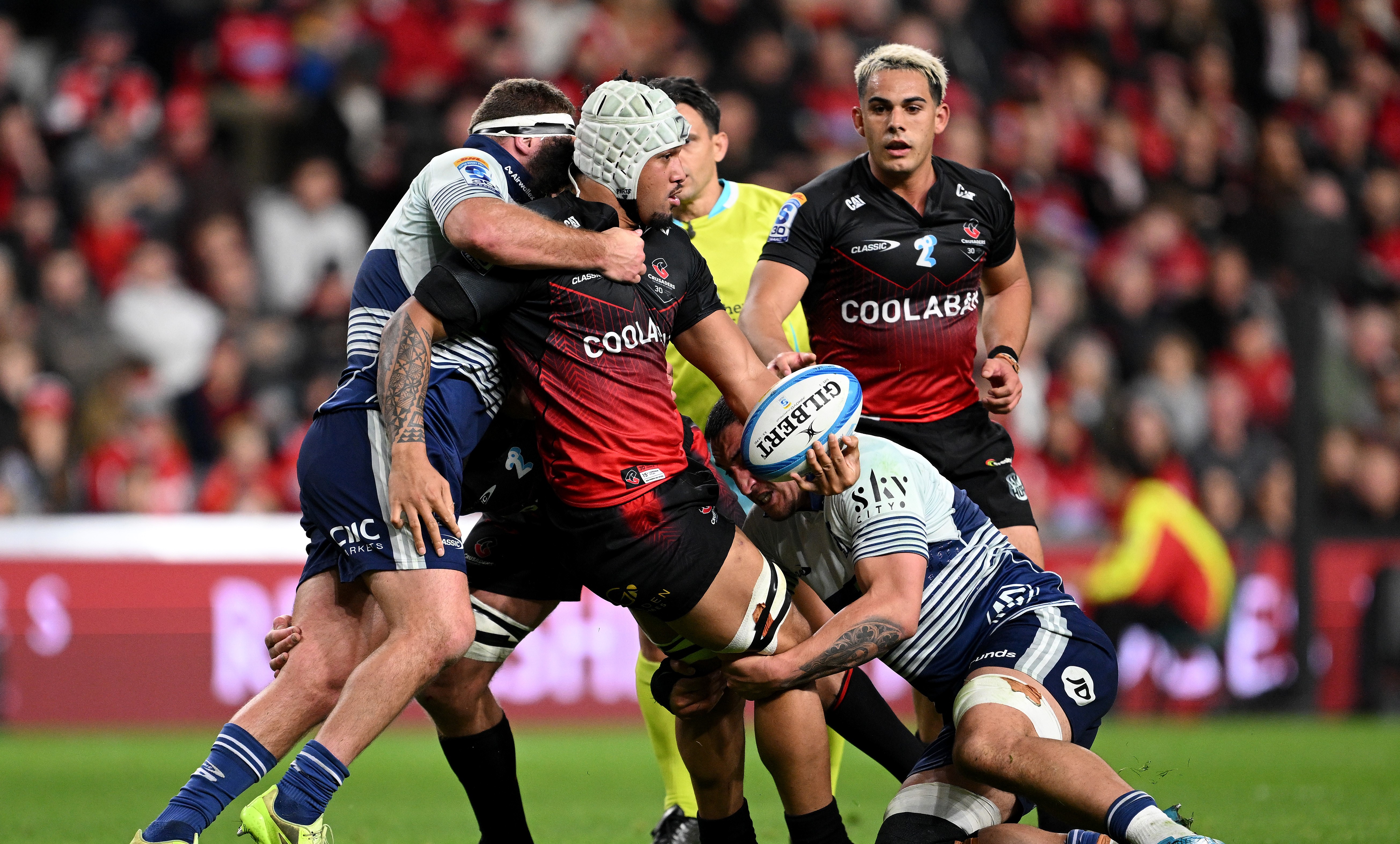 Leicester Fainga'anuku is tackled by the Blues during the Crusaders' playoff win at Te Kaha.