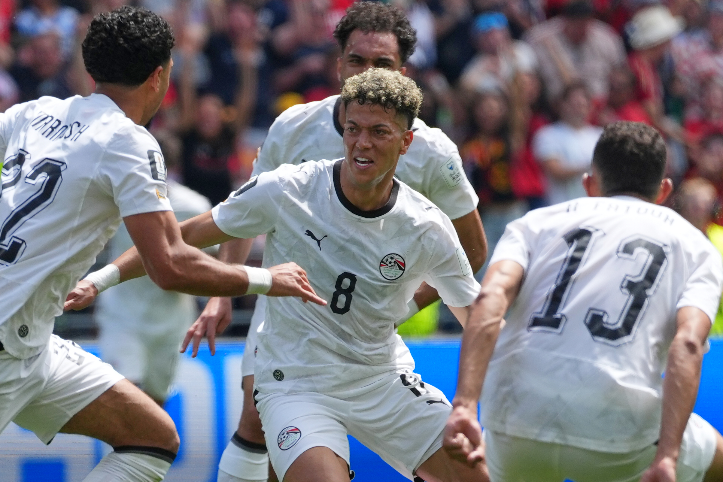 Egypt's Emam Ashour, centre celebrates with teammates after scoring the opening goal during the World Cup Group G soccer match between Belgium and Egypt in Seattle, Monday, June 15, 2026.