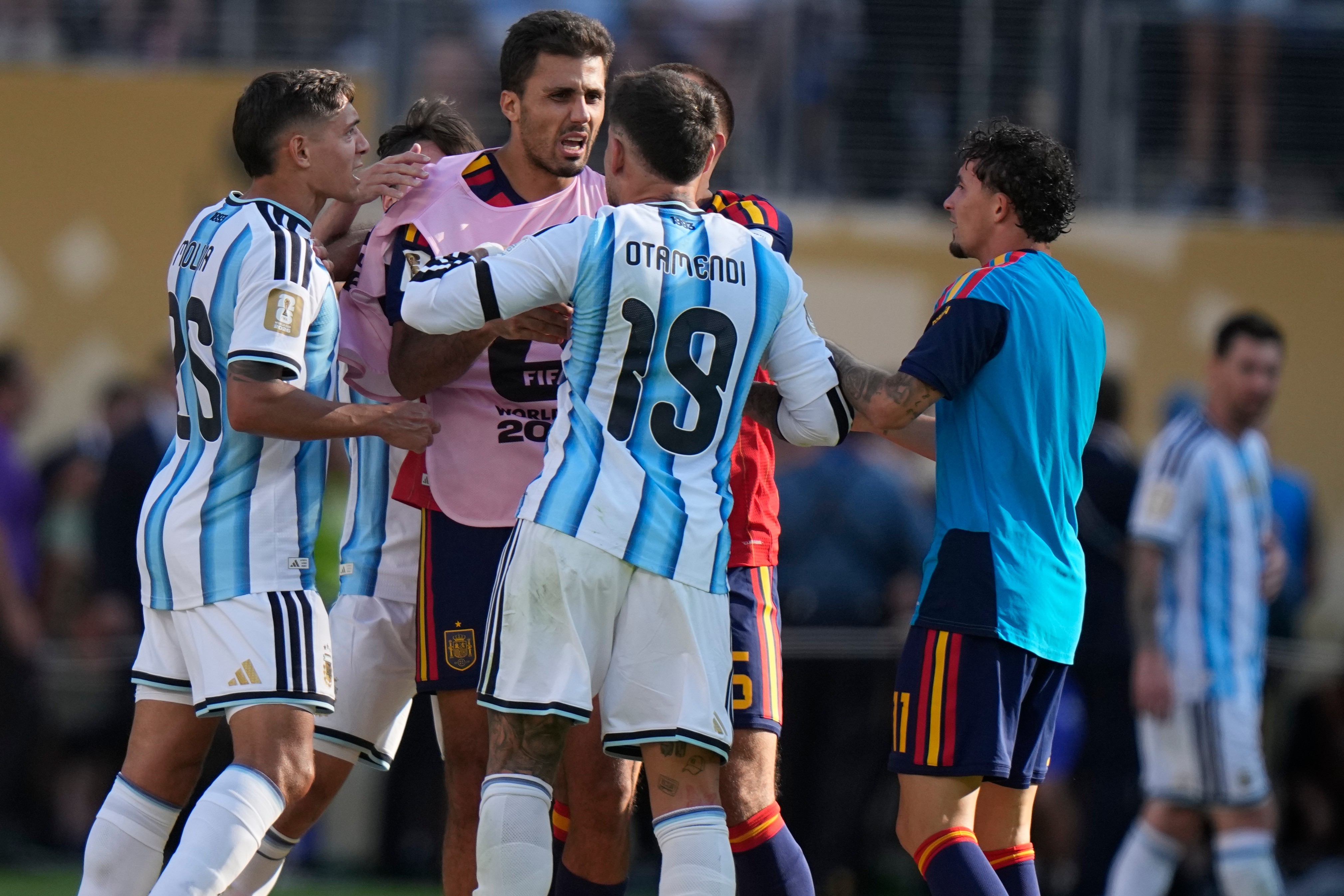 Argentina's Nicolas Otamendi (19) and Nahuel Molina (26) scuffle with Spain’s Rodri (16) after the World Cup final match between Spain and Argentina in East Rutherford.