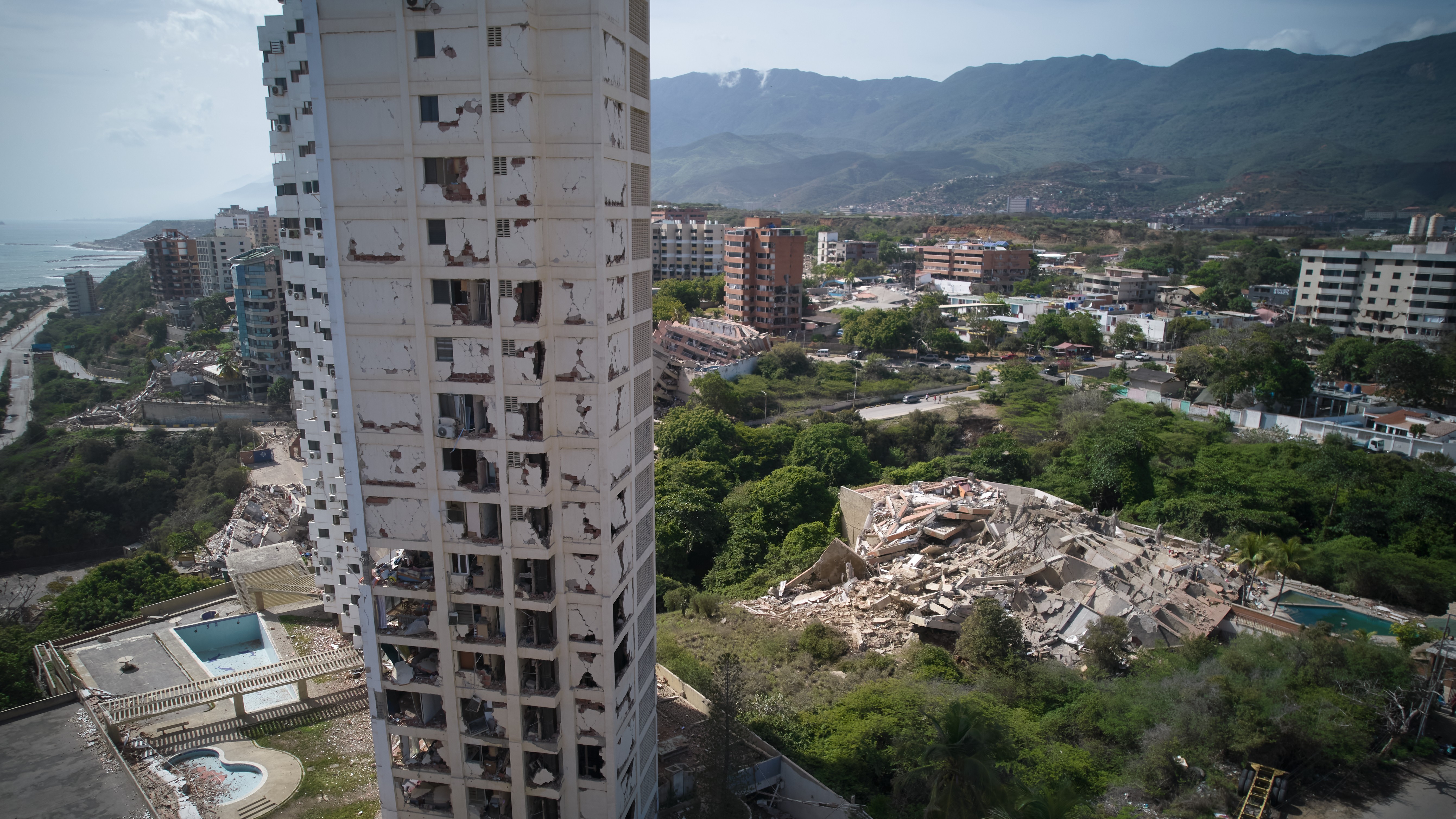 Damaged buildings stand a day after earthquakes struck La Guaira, Venezuela, Thursday, June 25, 2026.