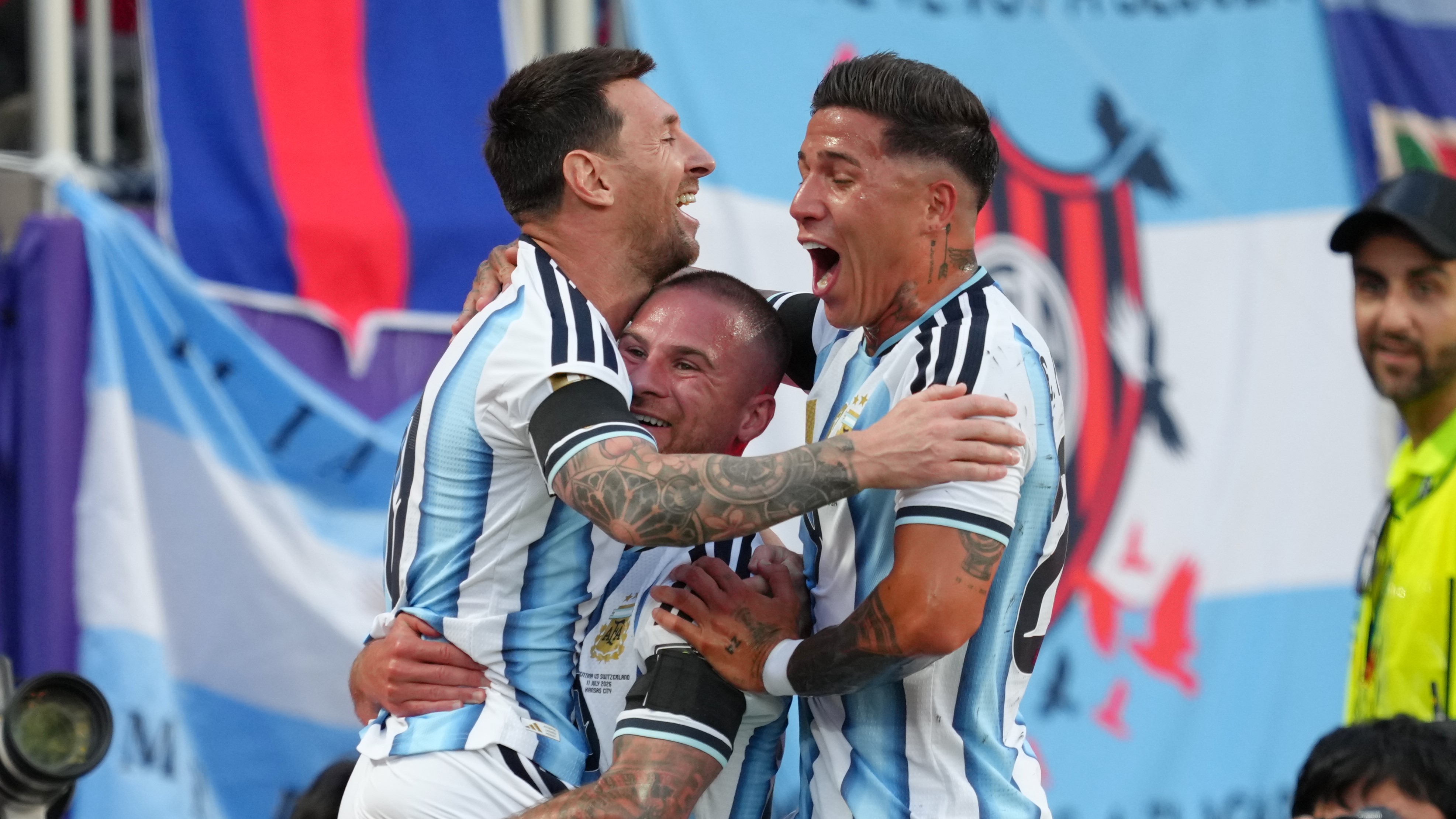 Alexis Mac Allister celebrates his goal for Argentina alongside Lionel Messi (left) and Enzo Fernandez (right).