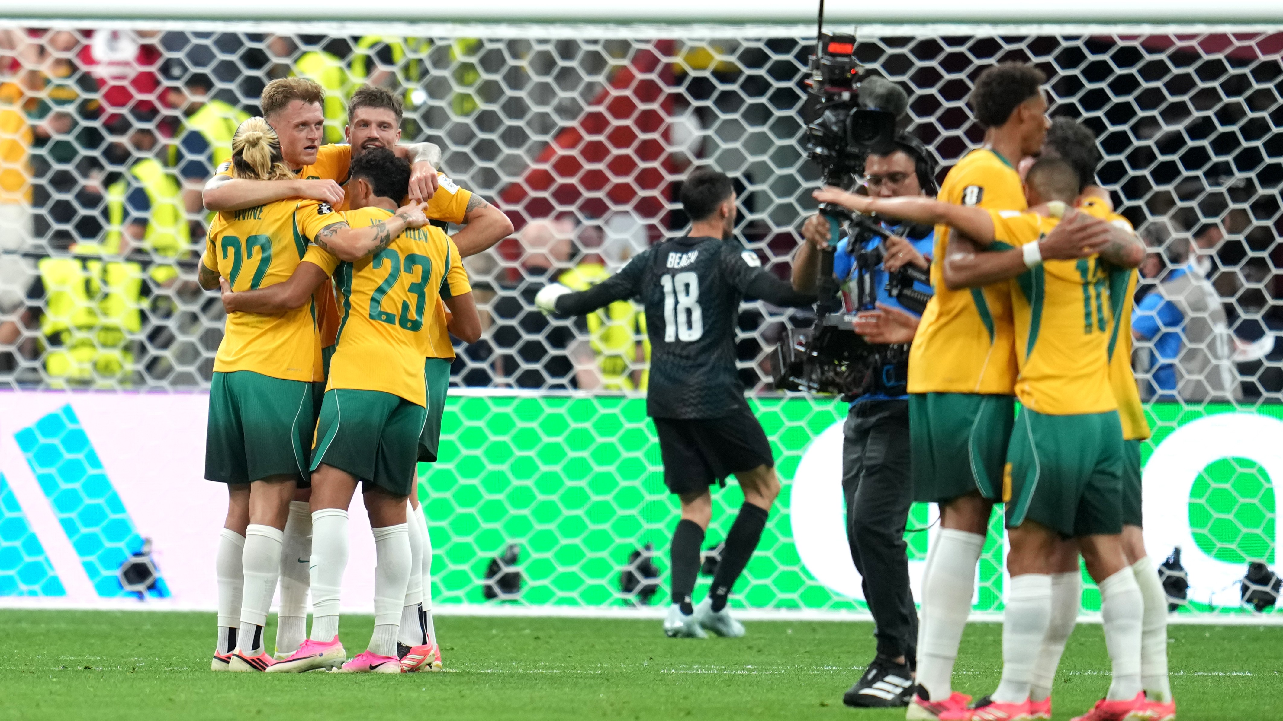 Australia players celebrate after the World Cup Group D soccer match between Australia and Turkey in Vancouver, British Columbia,.