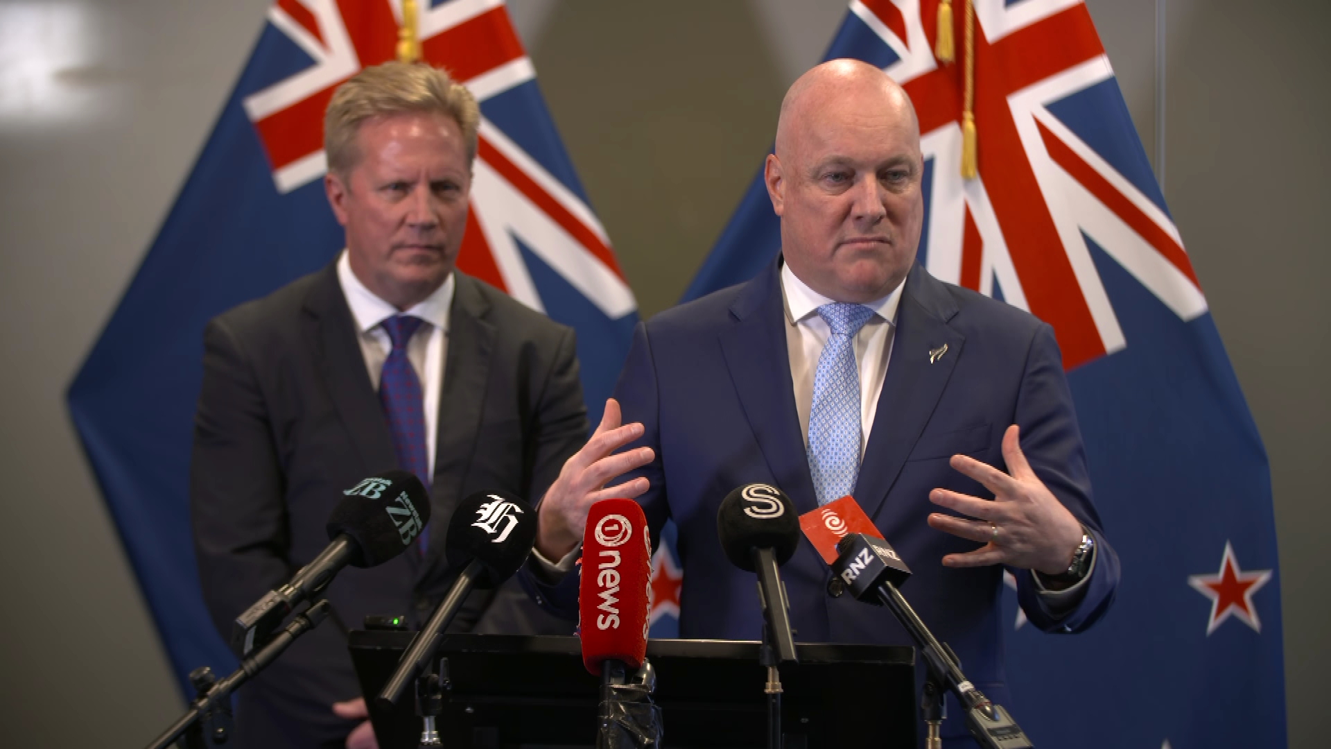 Todd McClay (left) and Christopher Luxon (right) speaking on the Government's trade agenda in Auckland.