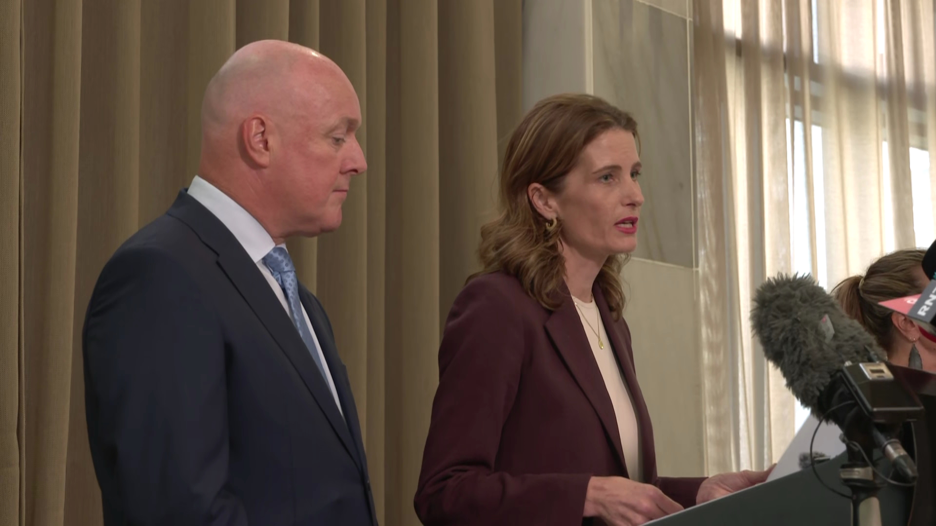 Prime Minister Christopher Luxon (left), Finance Minister Nicola Willis (right) speak to the media.