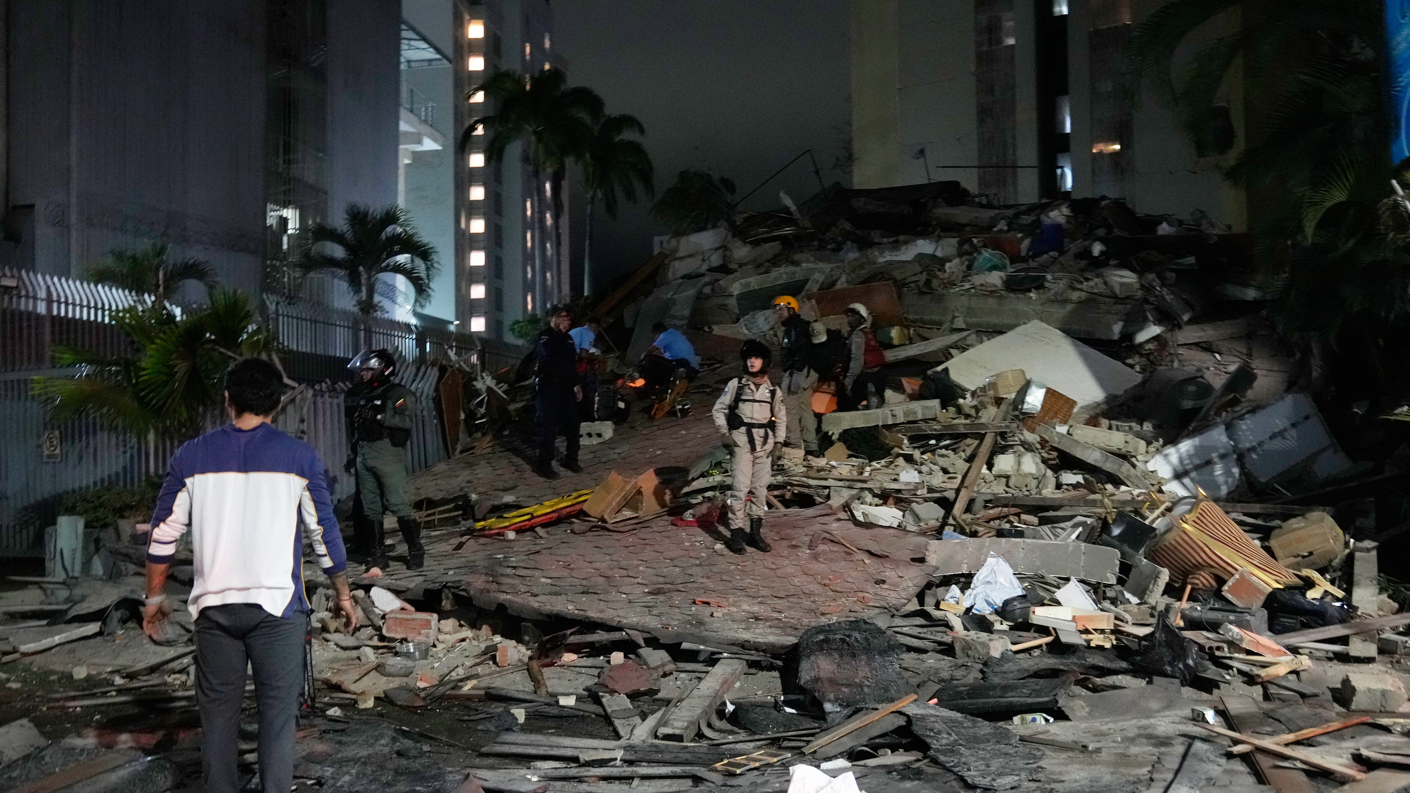 People walk amid debris after an earthquake in Caracas, Venezuela.