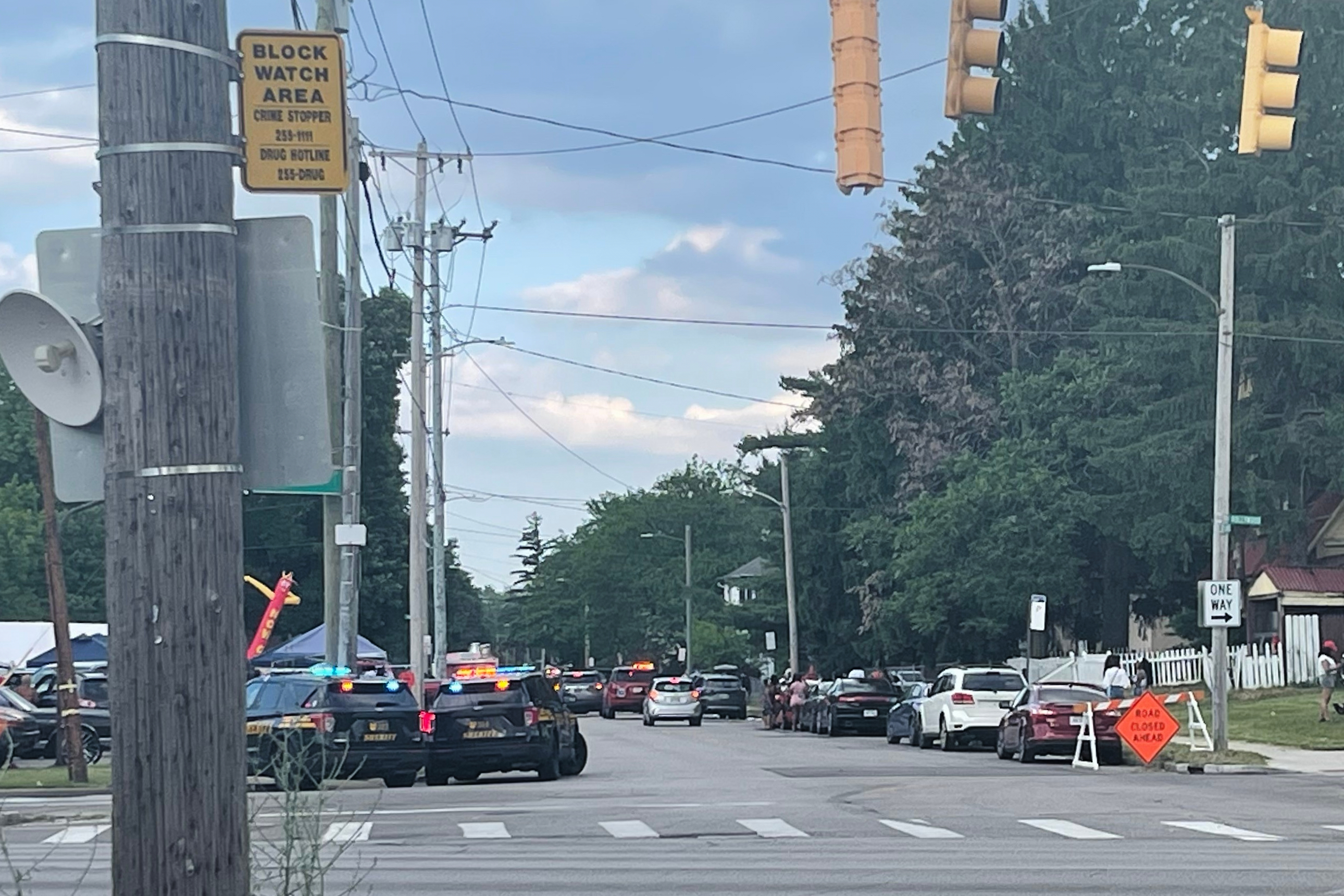 Police officers work at the scene of a shooting near a festival in Toledo, Ohio