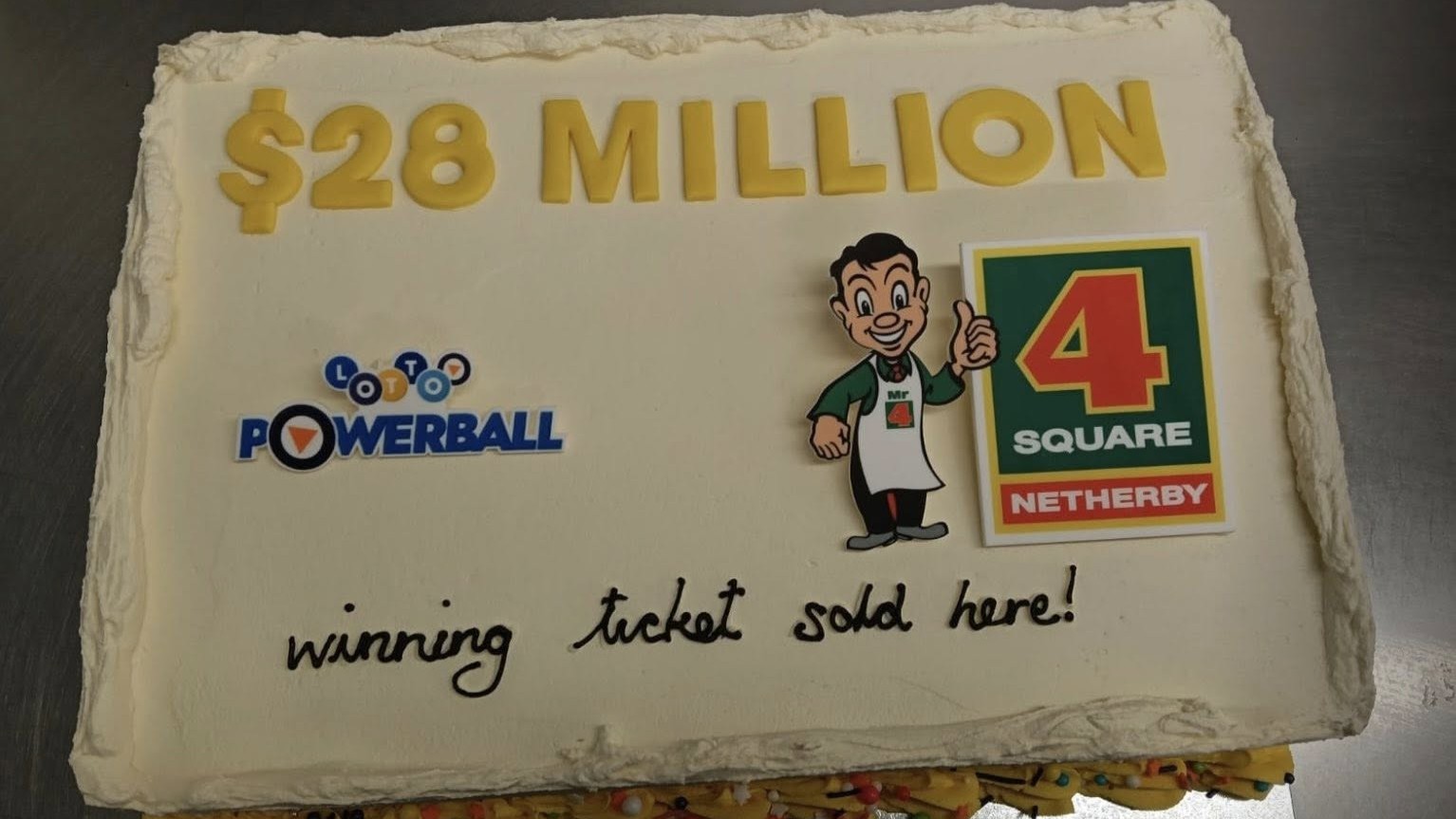 Four Square Netherby in Ashburton celebrate a $28m Lotto ticket sold with cake.