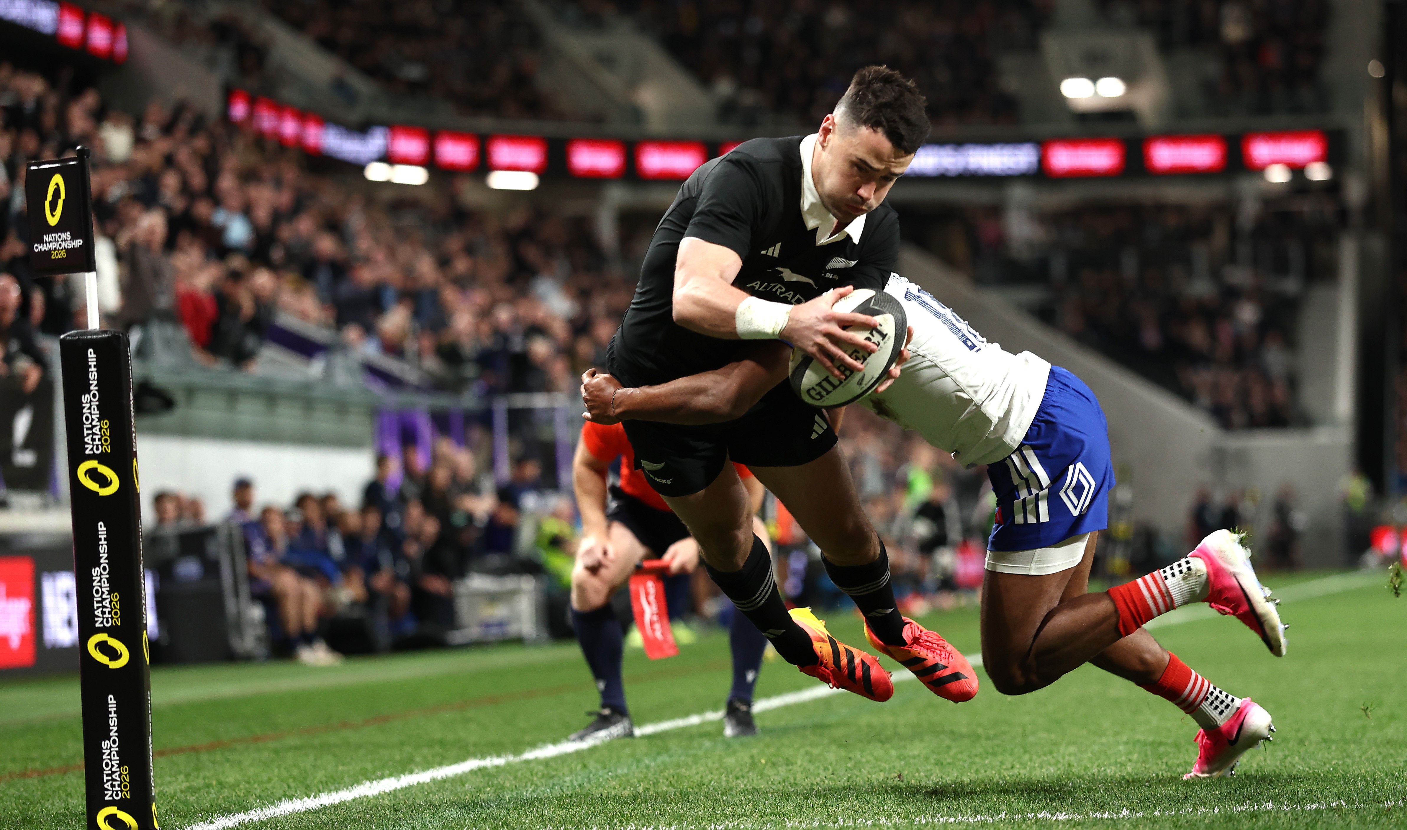 Will Jordan scores the first of his two tries for the All Blacks against France.
