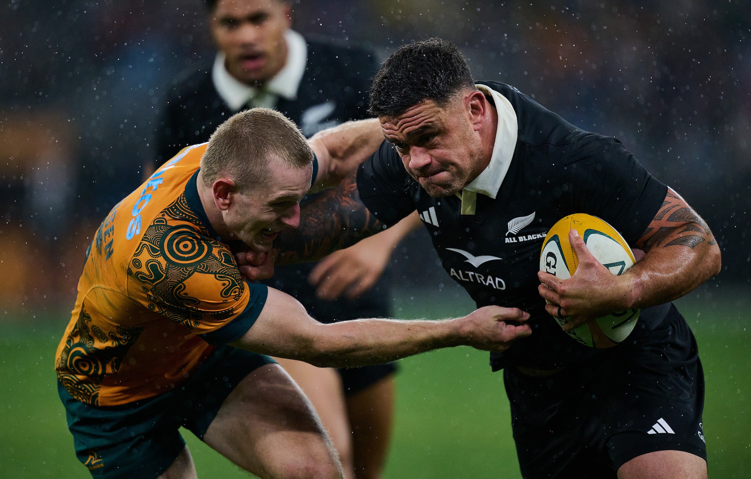 Codie Taylor pushes off Max Jorgensen during the All Blacks victory over the Wallabies in Perth last year.