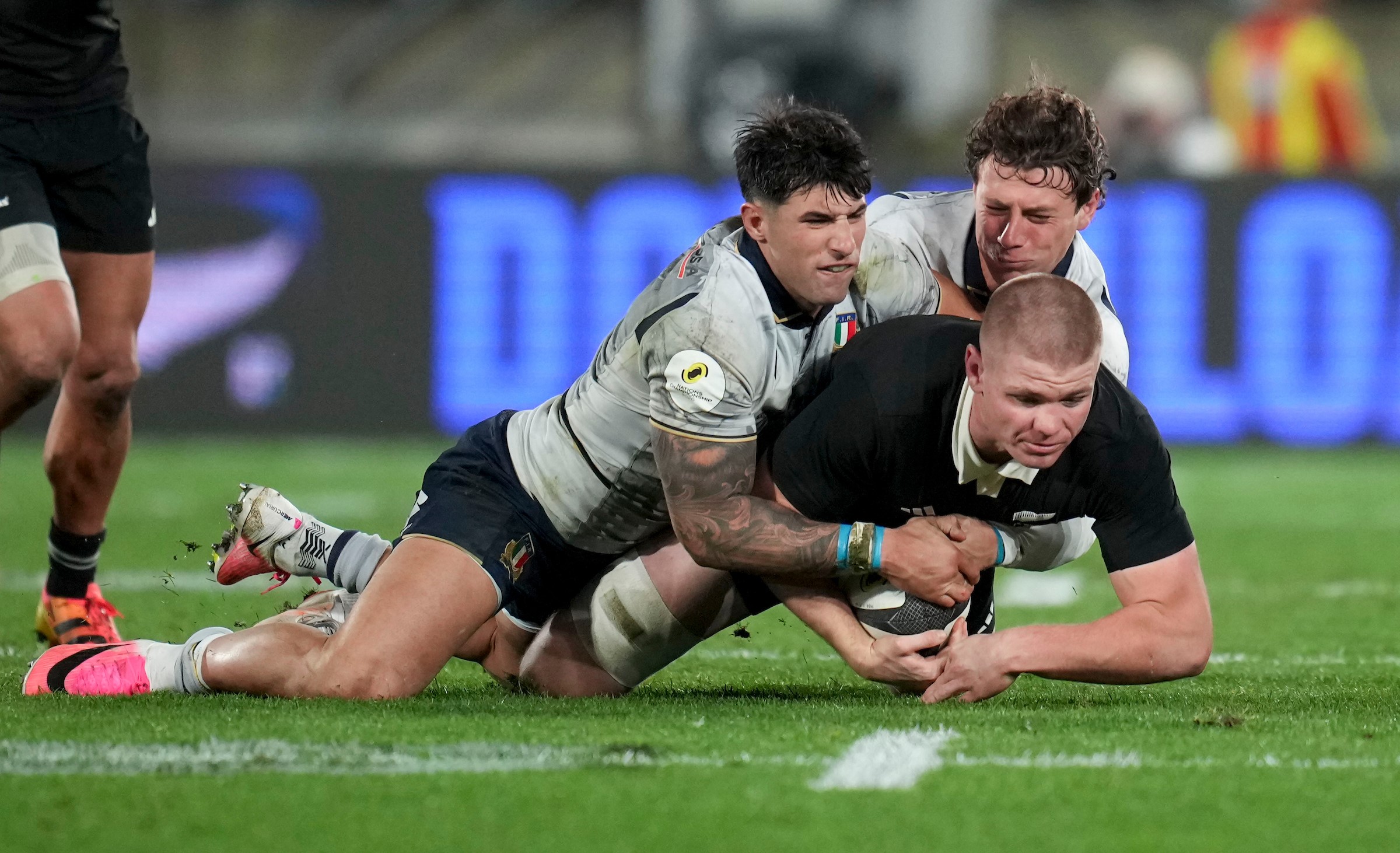 All Blacks flanker Anton Segner is tackled during his team's win over Italy in Wellington.