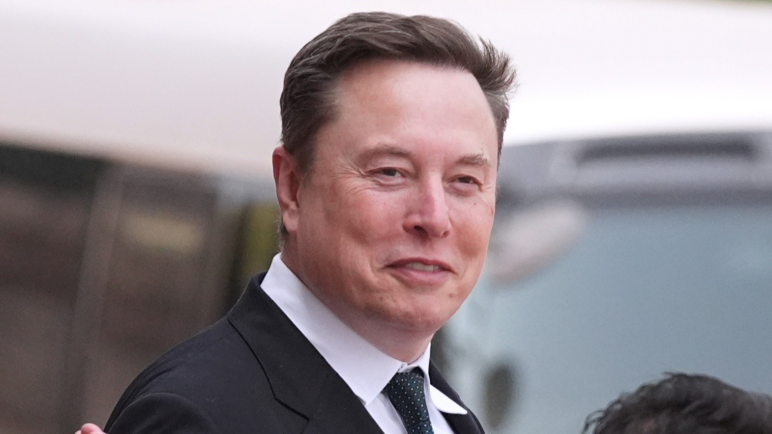 Elon Musk departs after a welcome ceremony with President Donald Trump and China's President Xi Jinping at the Great Hall of the People, Thursday, May 14, 2026, in Beijing.