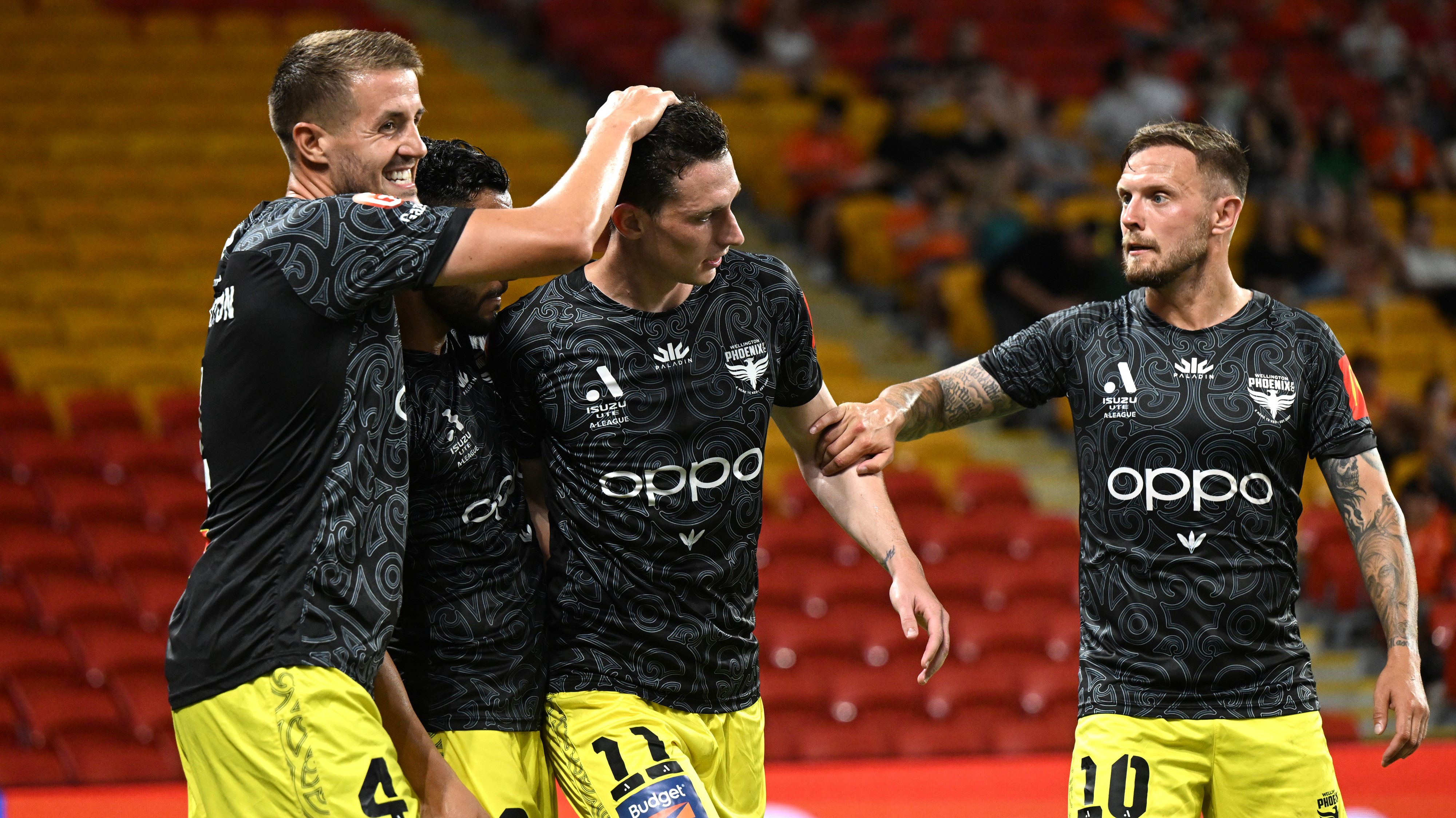 Alex Rufer, of the Wellington Phoenix leads the team out during