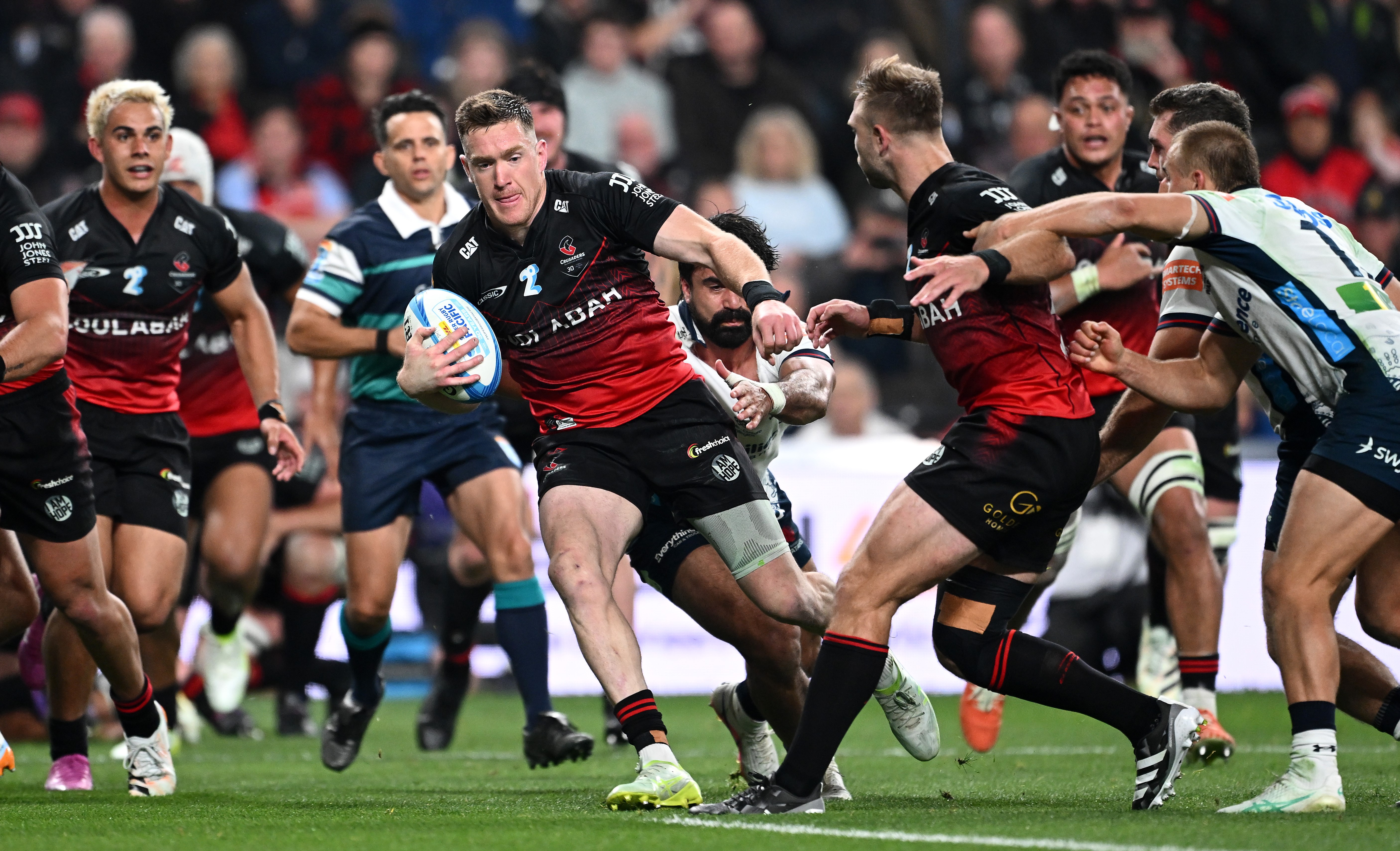 Crusaders wing Dallas McLeod breaks away against the Waratahs at Te Kaha Stadium.