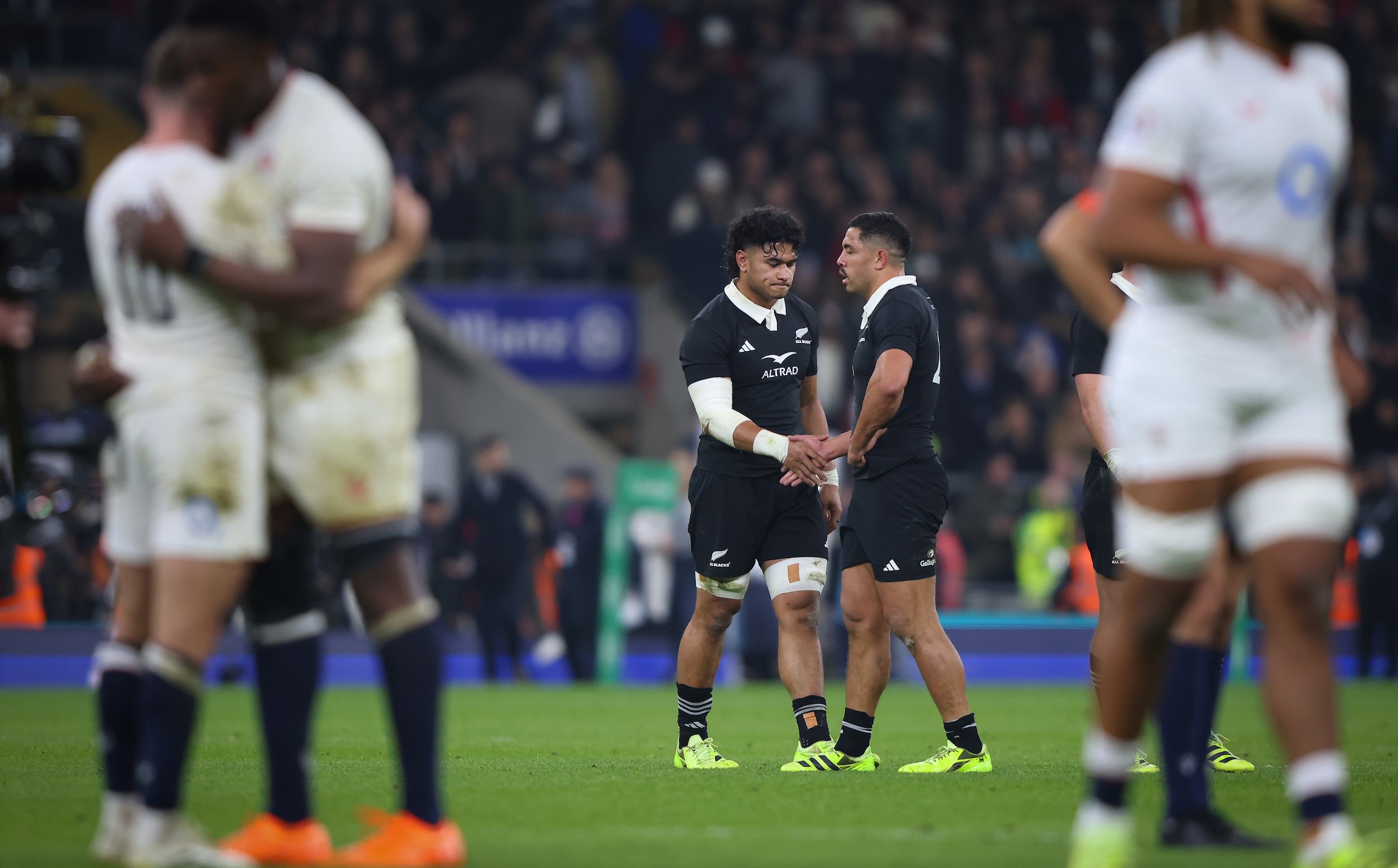 Wallace Sititi, left, and Anton Lienert-Brown shake hands after losing to England at Twickenham in November.
