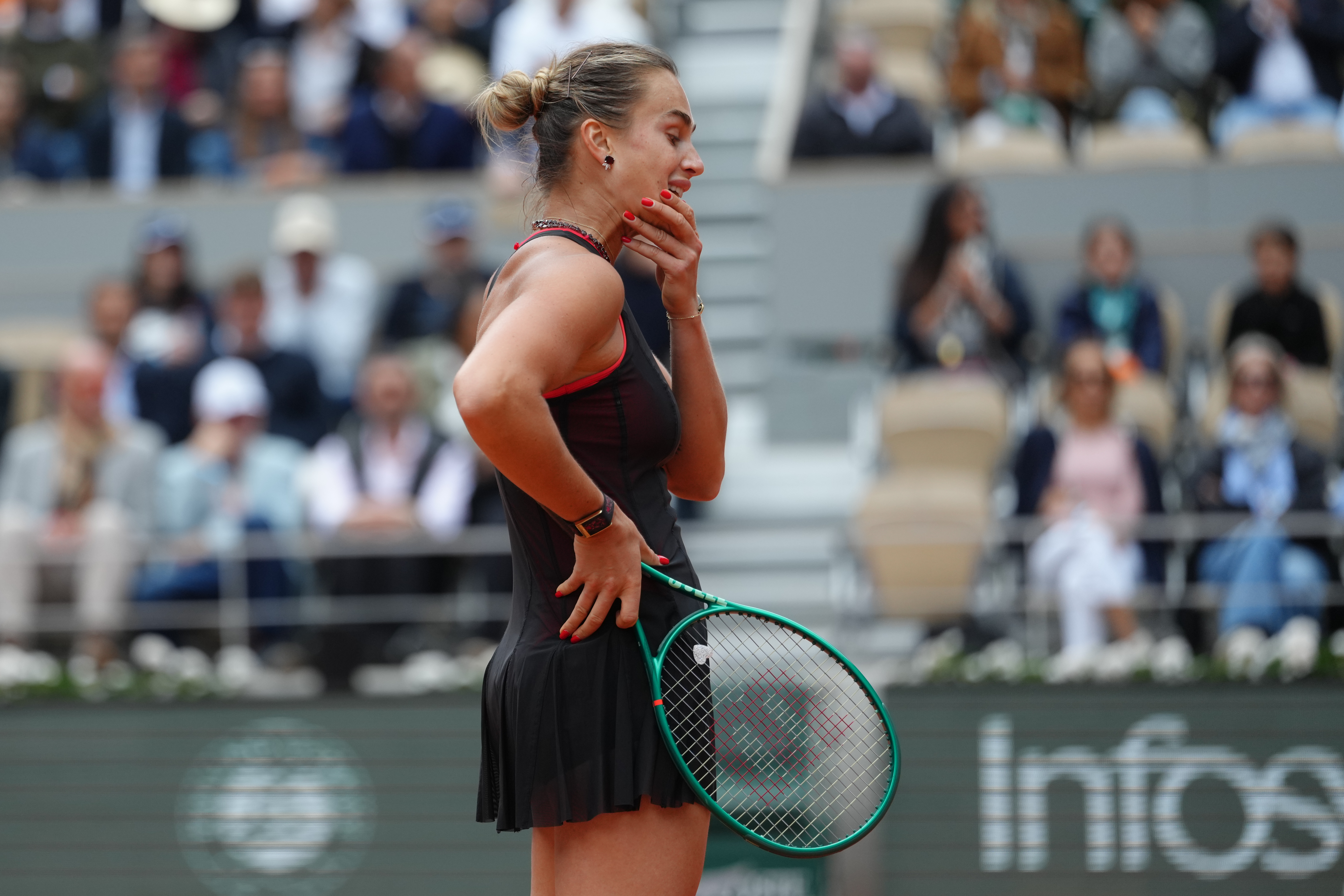 Aryna Sabalenka of Belarus reacts during the quarterfinal tennis match against Russia's Diana Shnaider at the French Open in Paris. 
