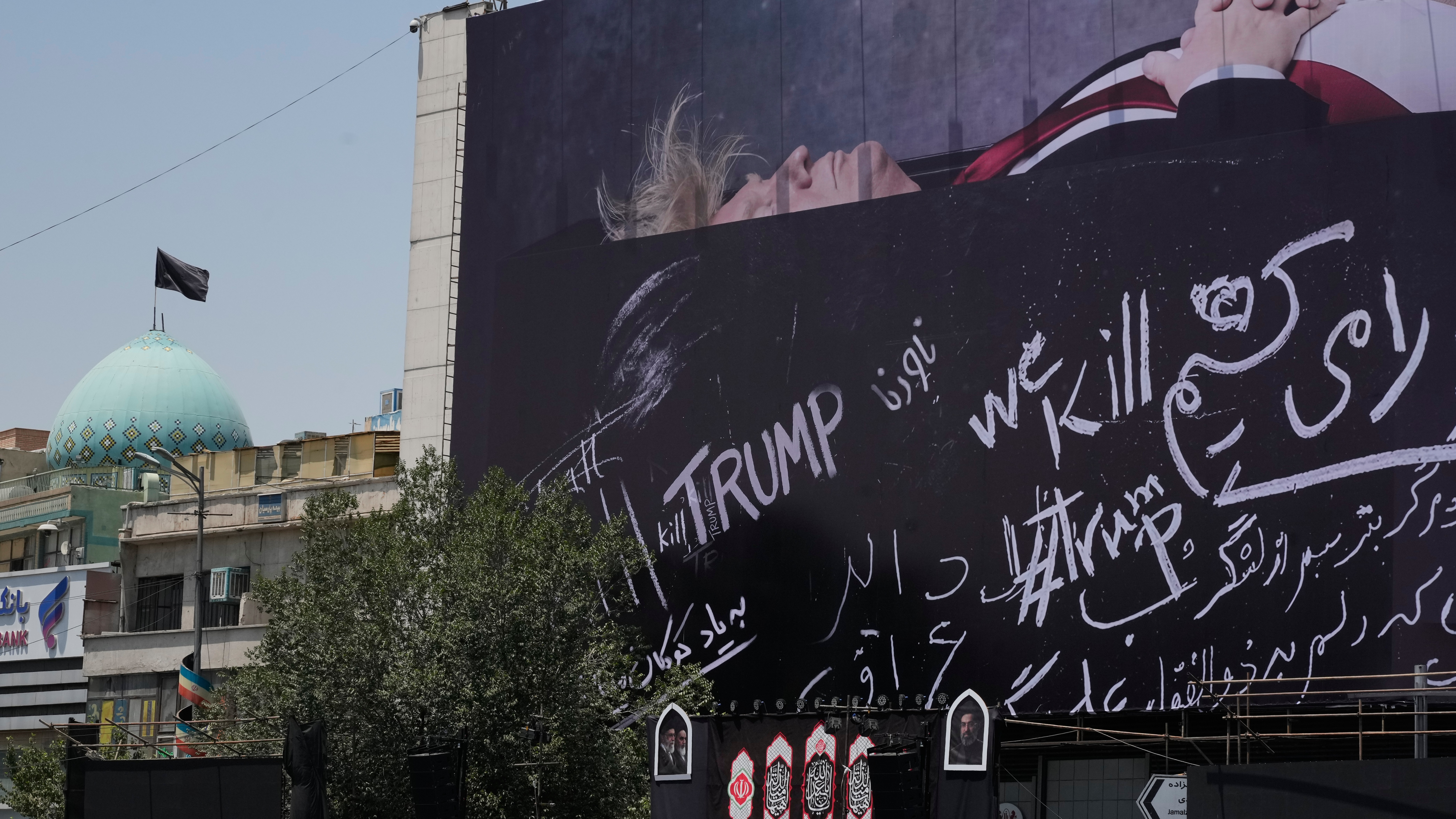 A billboard bearing anti-Trump messages, including the phrase