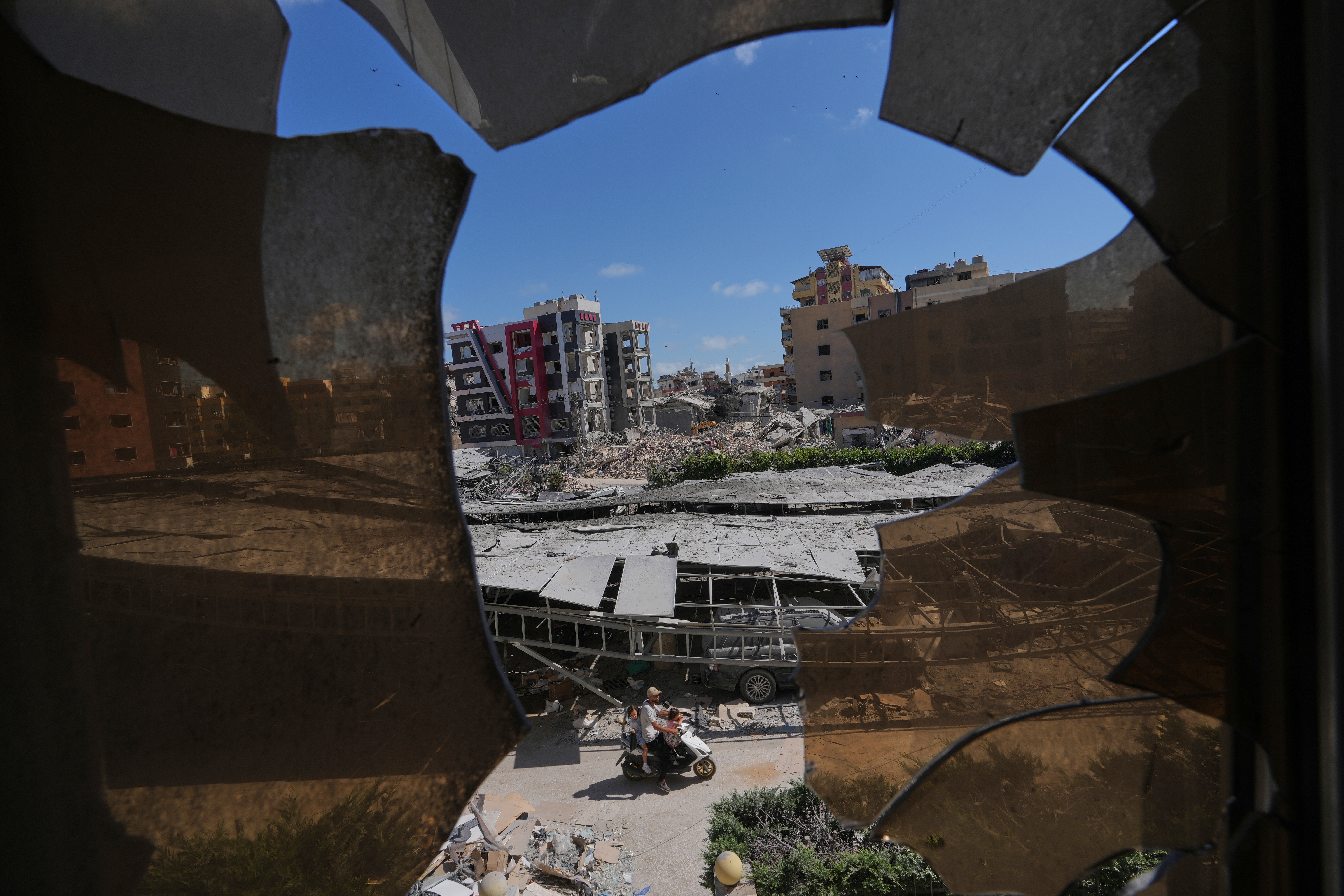 The southern town of Khiam, Lebanon, is seen through a fence near the Lebanon-Israel border, Wednesday, June 10, 2026. 