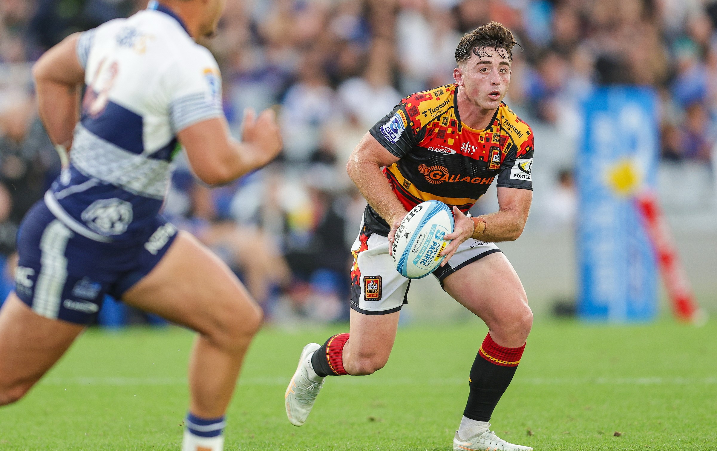 First-five Josh Jacomb runs the ball for the Chiefs.