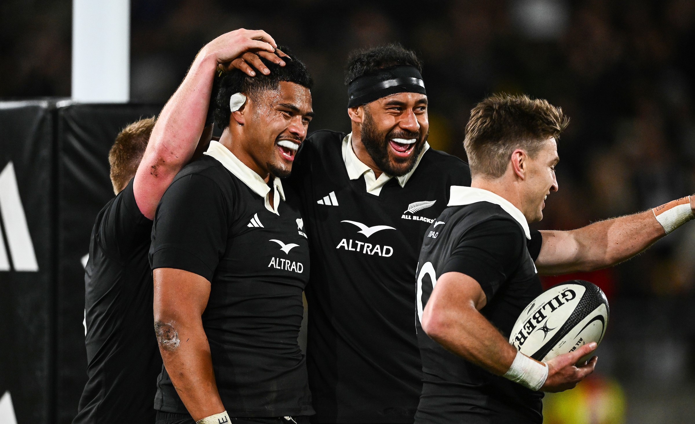 Tupou Vaa'i celebrates his try in Wellington with Patrick Tuipulotu and Beauden Barrett.