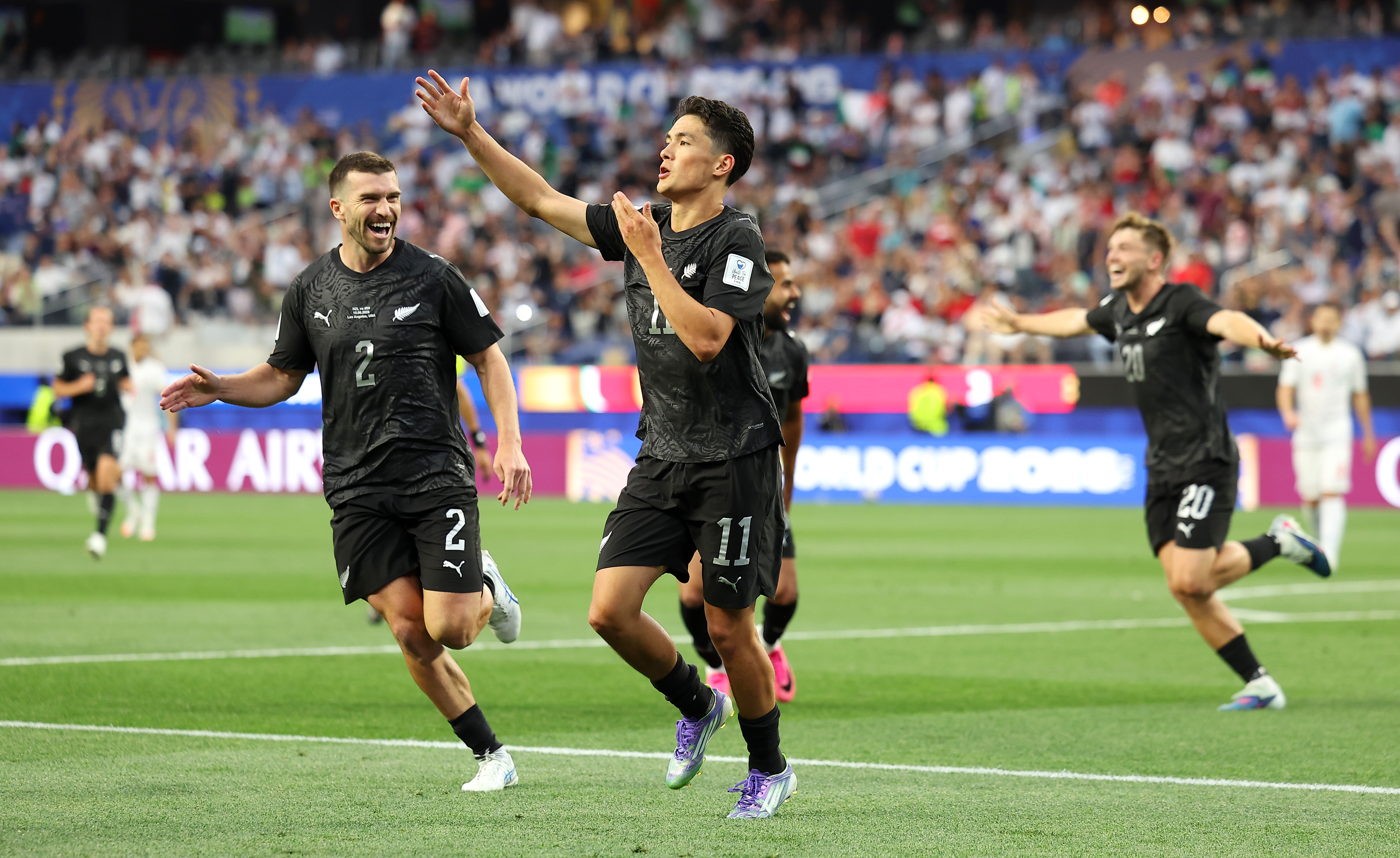 Eli Just celebrates scoring against Iran at the World Cup.
