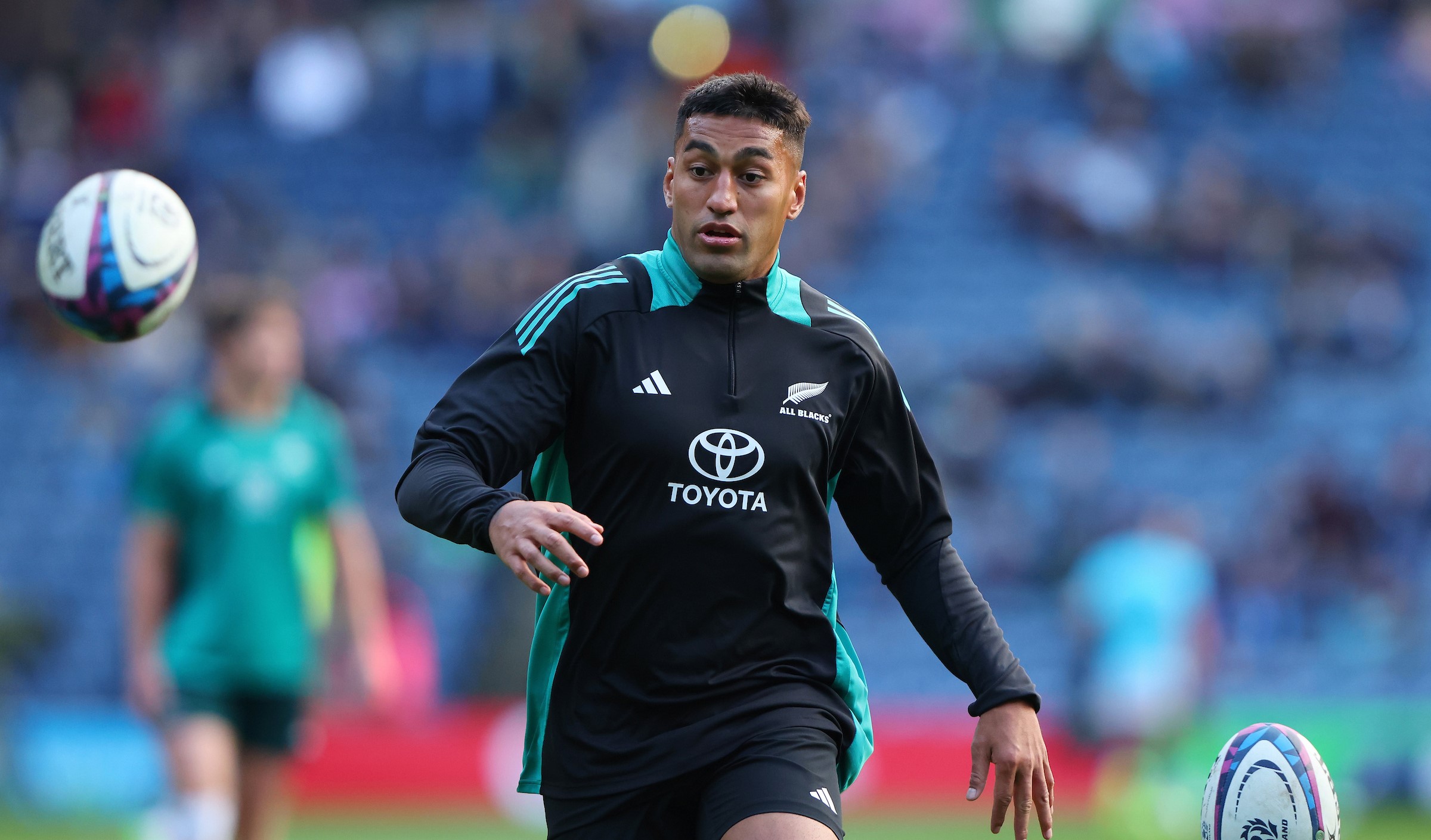 Rieko Ioane warms up with the All Blacks before the recent victory over Scotland.