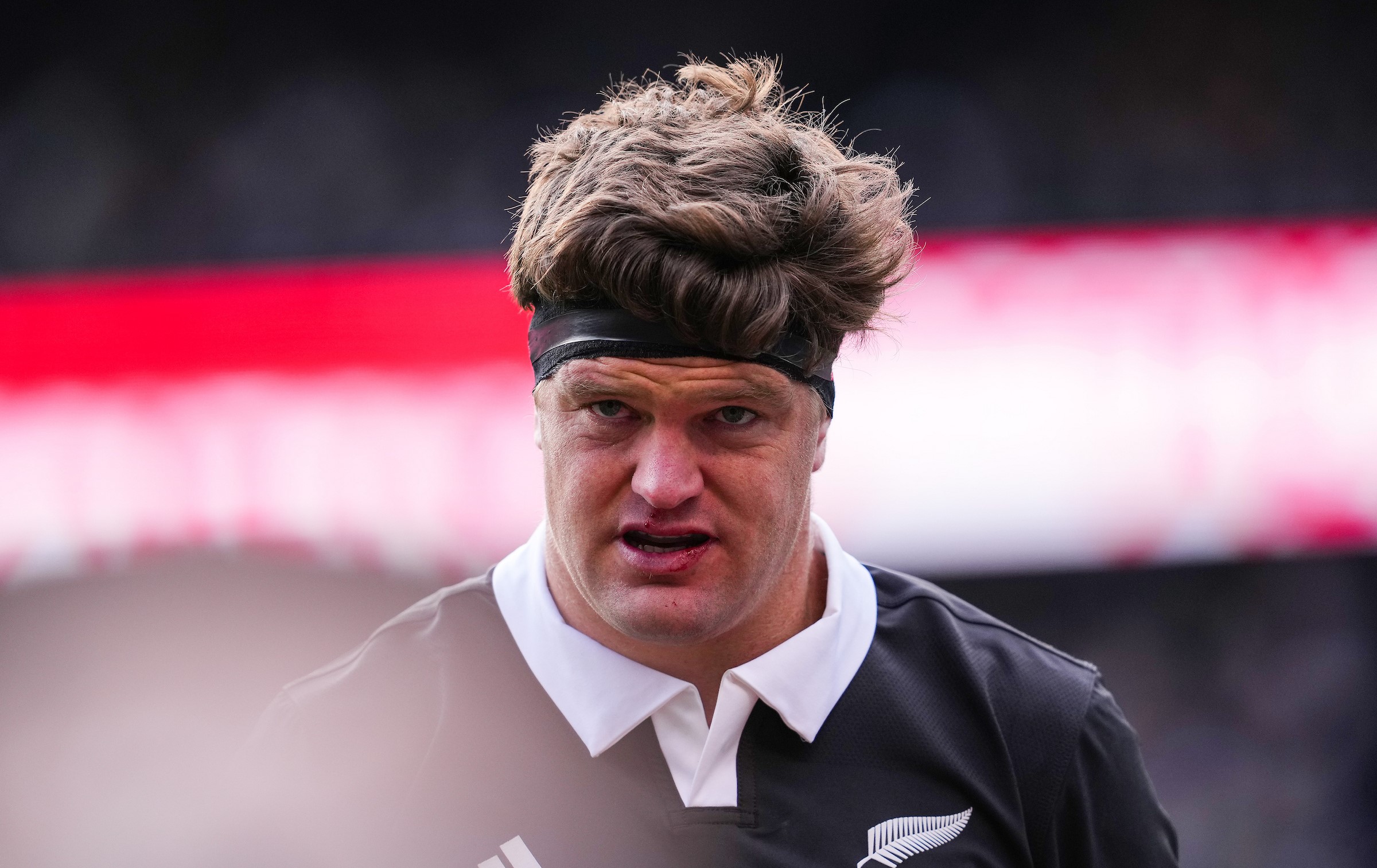 All Blacks skipper Scott Barrett walks off the Soldier Field pitch after his early injury against Ireland.