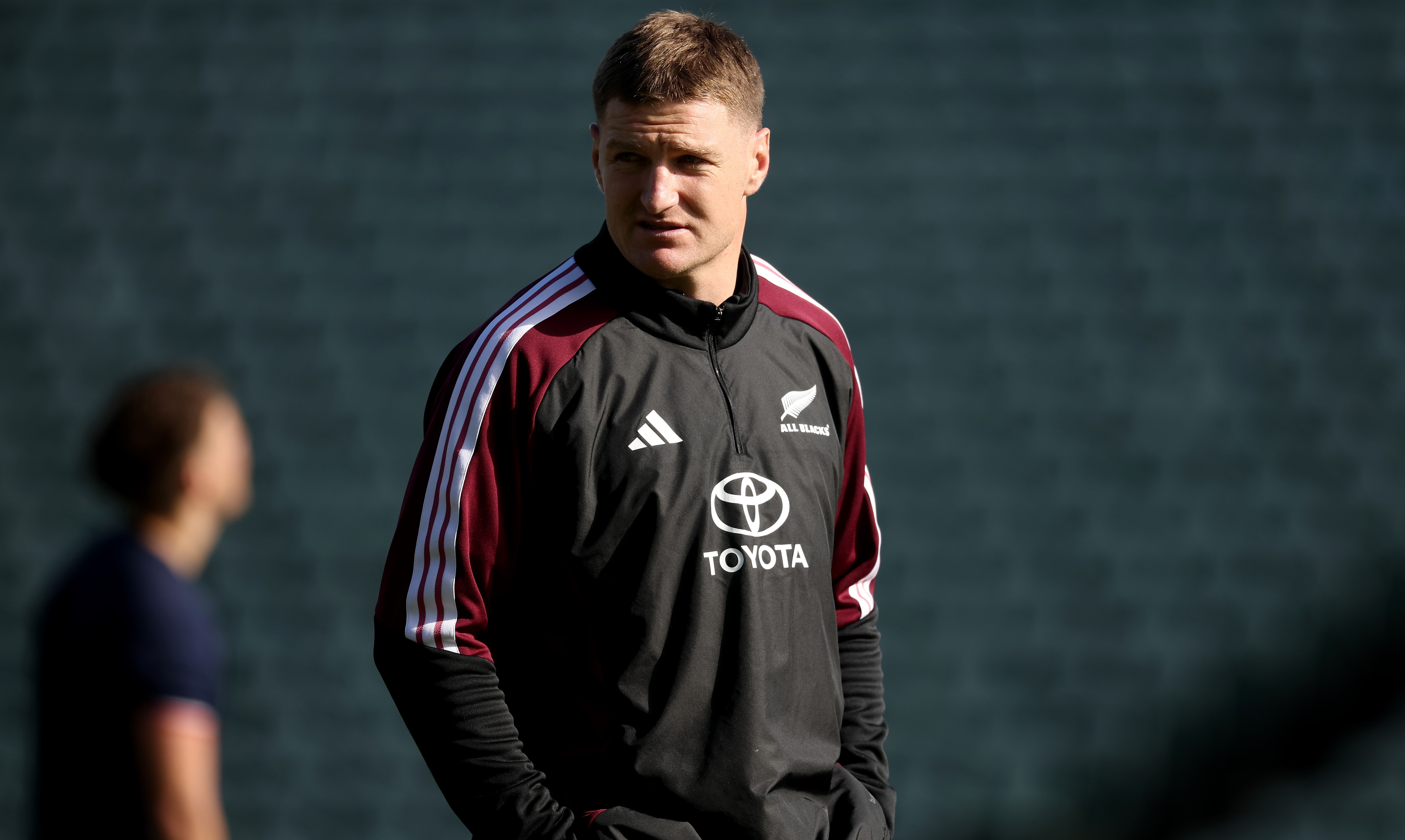 Jordie Barrett watches over All Blacks training at North Harbour Stadium today due to a minor leg injury.
