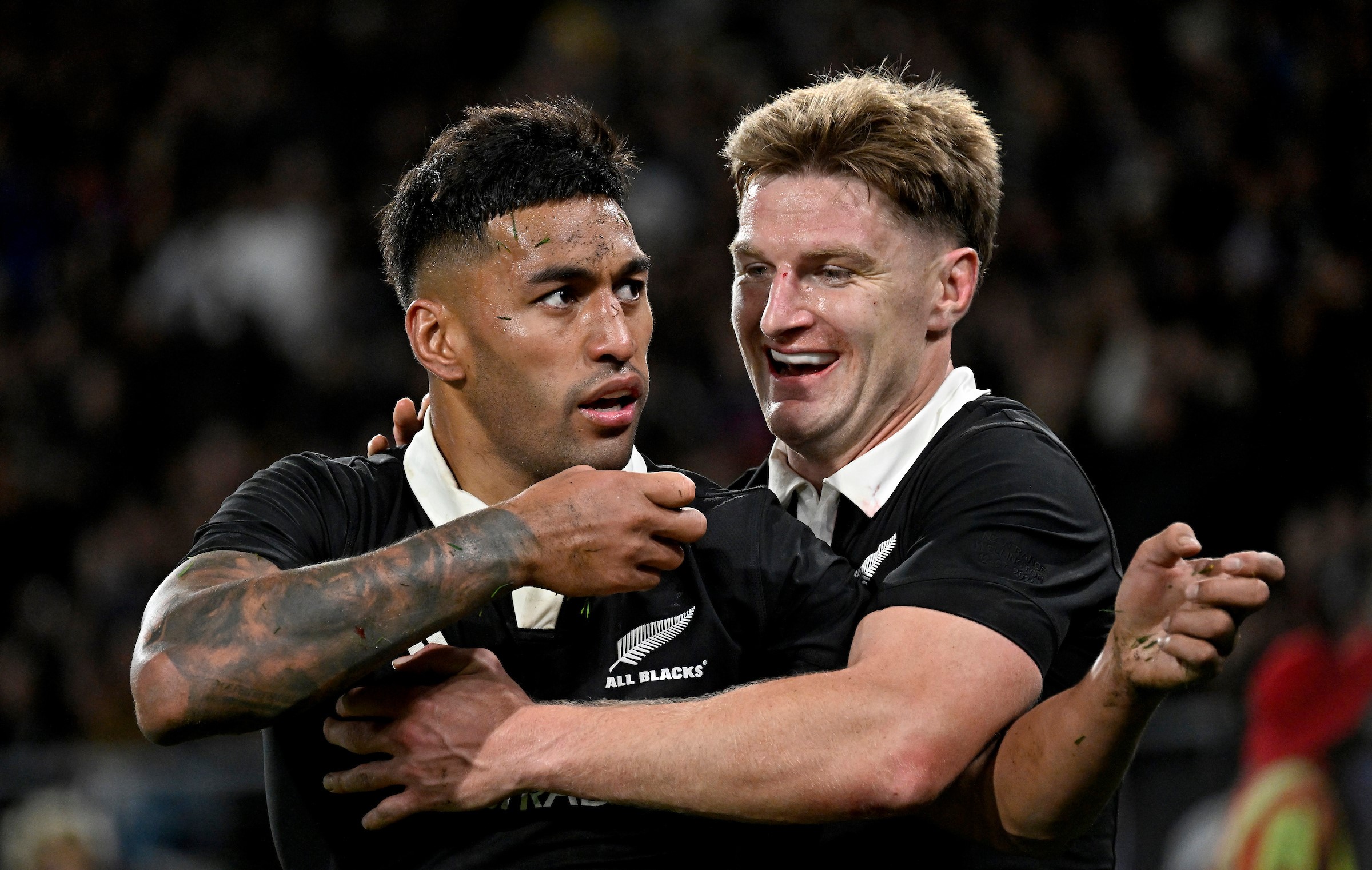 Rieko Ioane celebrates his try against France with teammate Jordie Barrett.