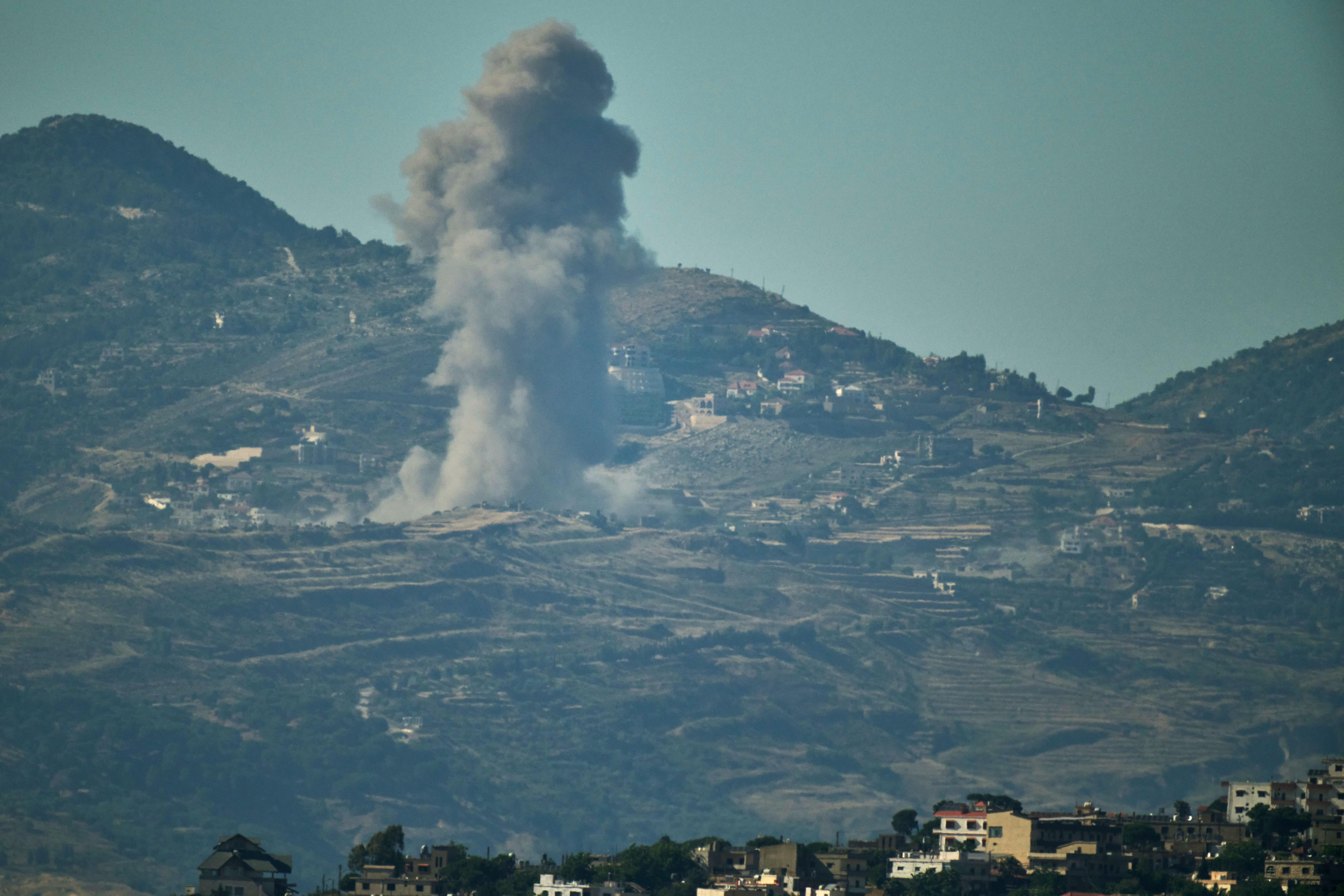 Smoke rises to the sky following an Israeli military strike in southern Lebanon as seen from northern Israel, Friday, June 19, 2026.