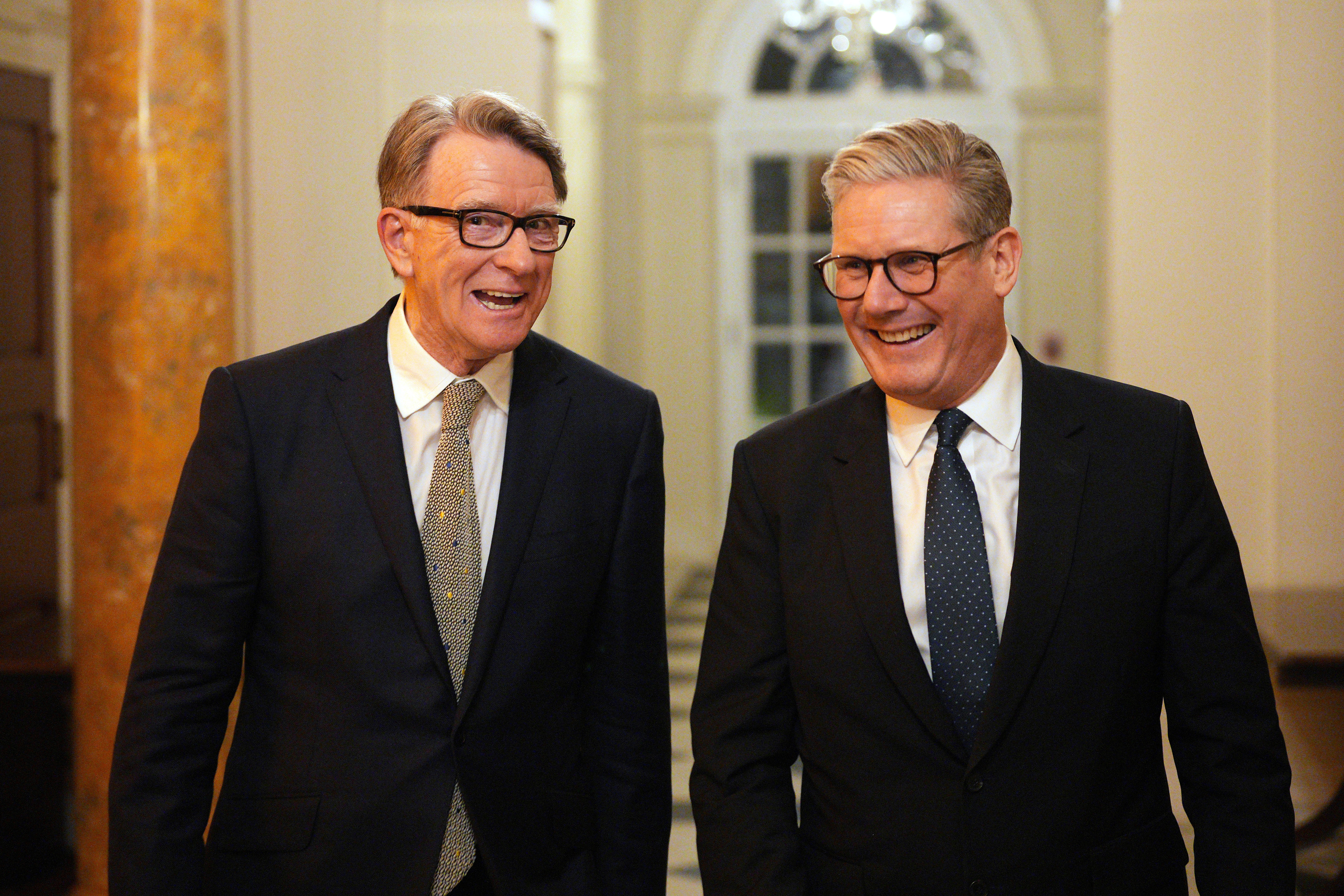 British Prime Minister Keir Starmer, right, talks with Britain's ambassador to the United States Peter Mandelson during a welcome reception at the ambassador's residence on Wednesday, Feb. 26, 2025
