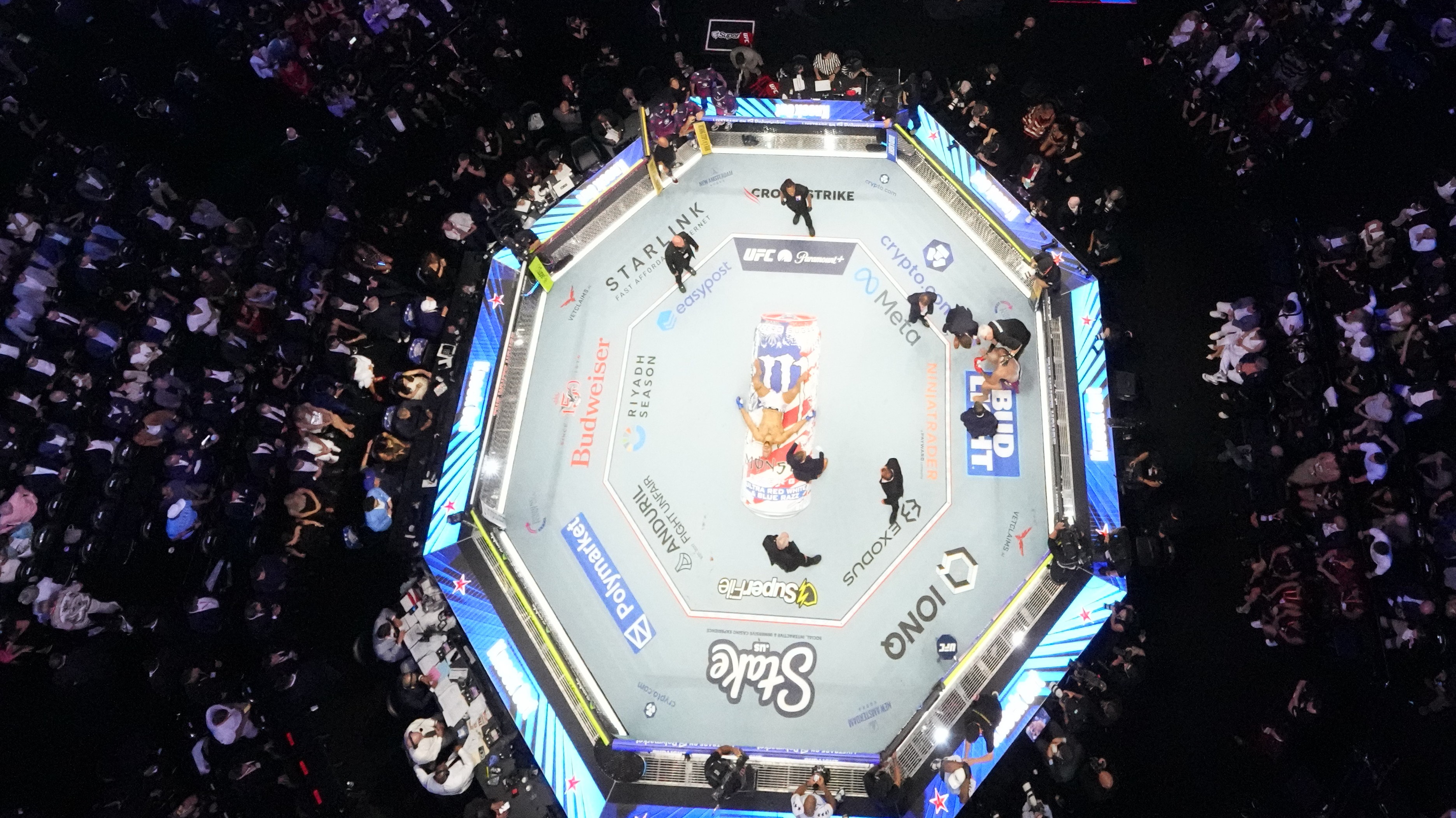 Alex Pereira, far right, is attended to, as Ciryl Gane lays in the center of the ring during UFC Freedom 250 on the South Lawn of the White House, Monday, June 15, 2026, in Washington.