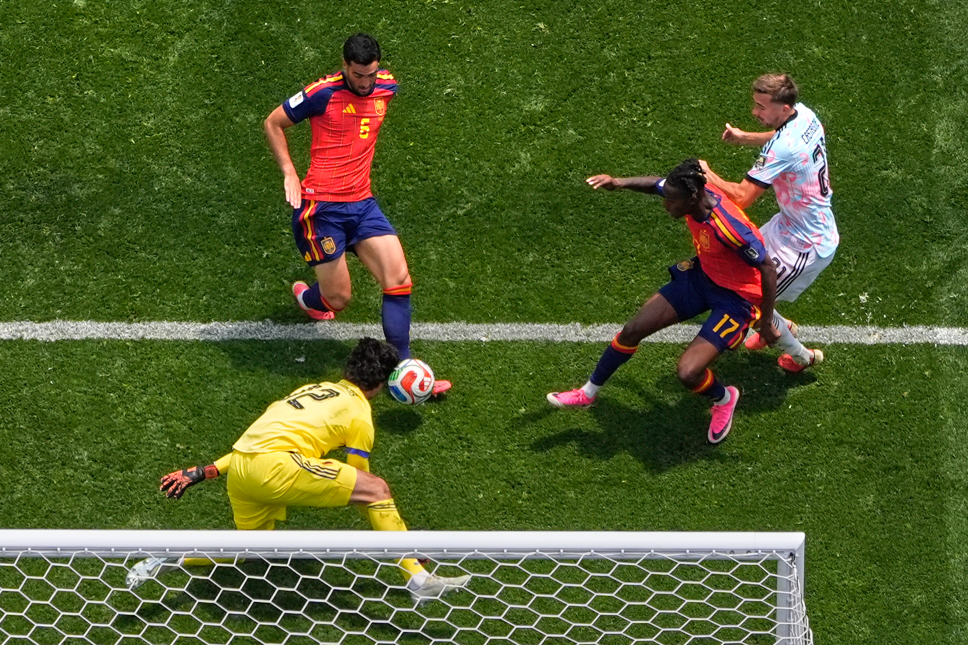 Spain's Mikel Merino (6) scores their second goal during the World Cup quarterfinal