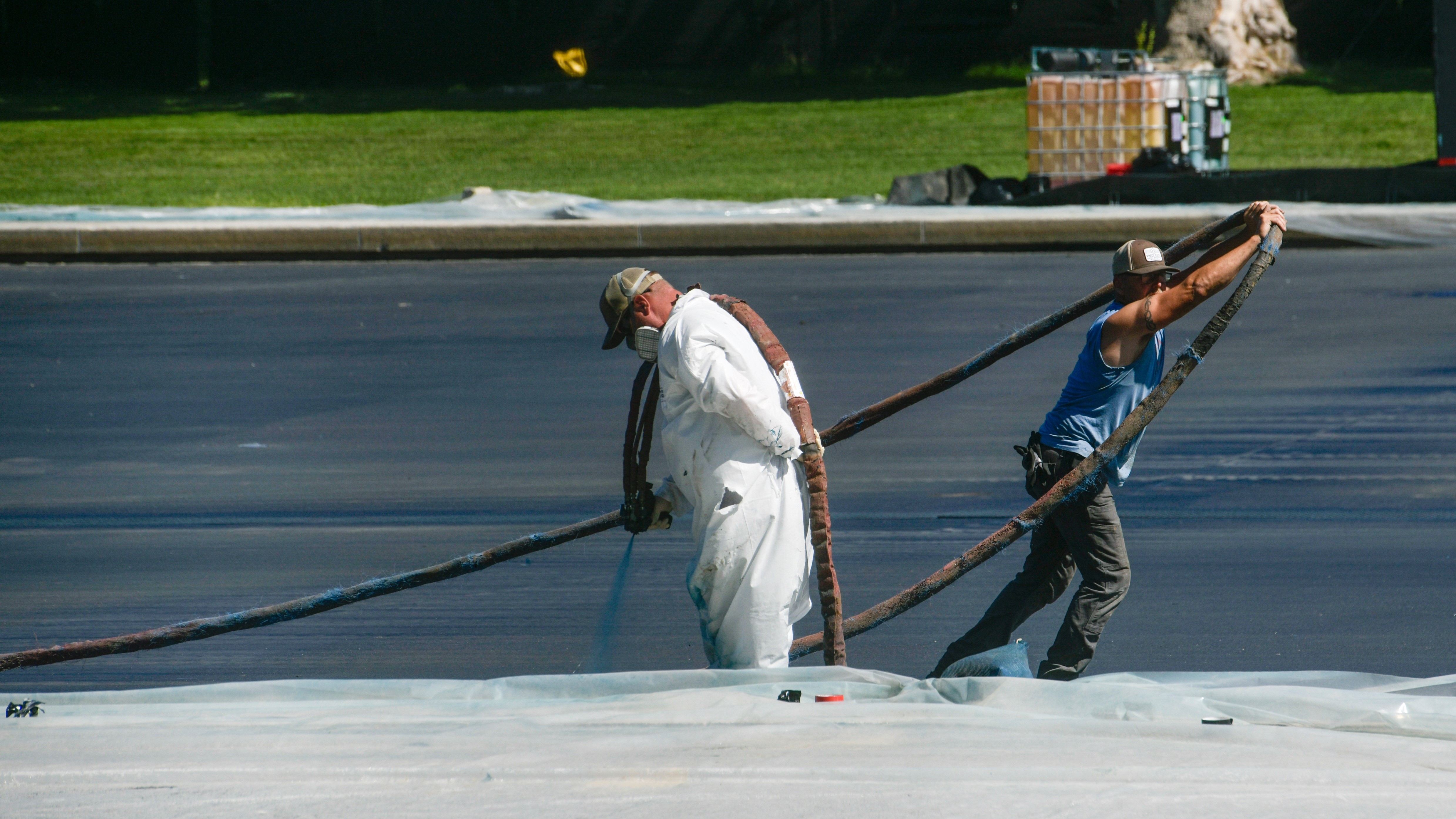 The Reflecting Pool was painted an 'American flag blue', according to Trump.