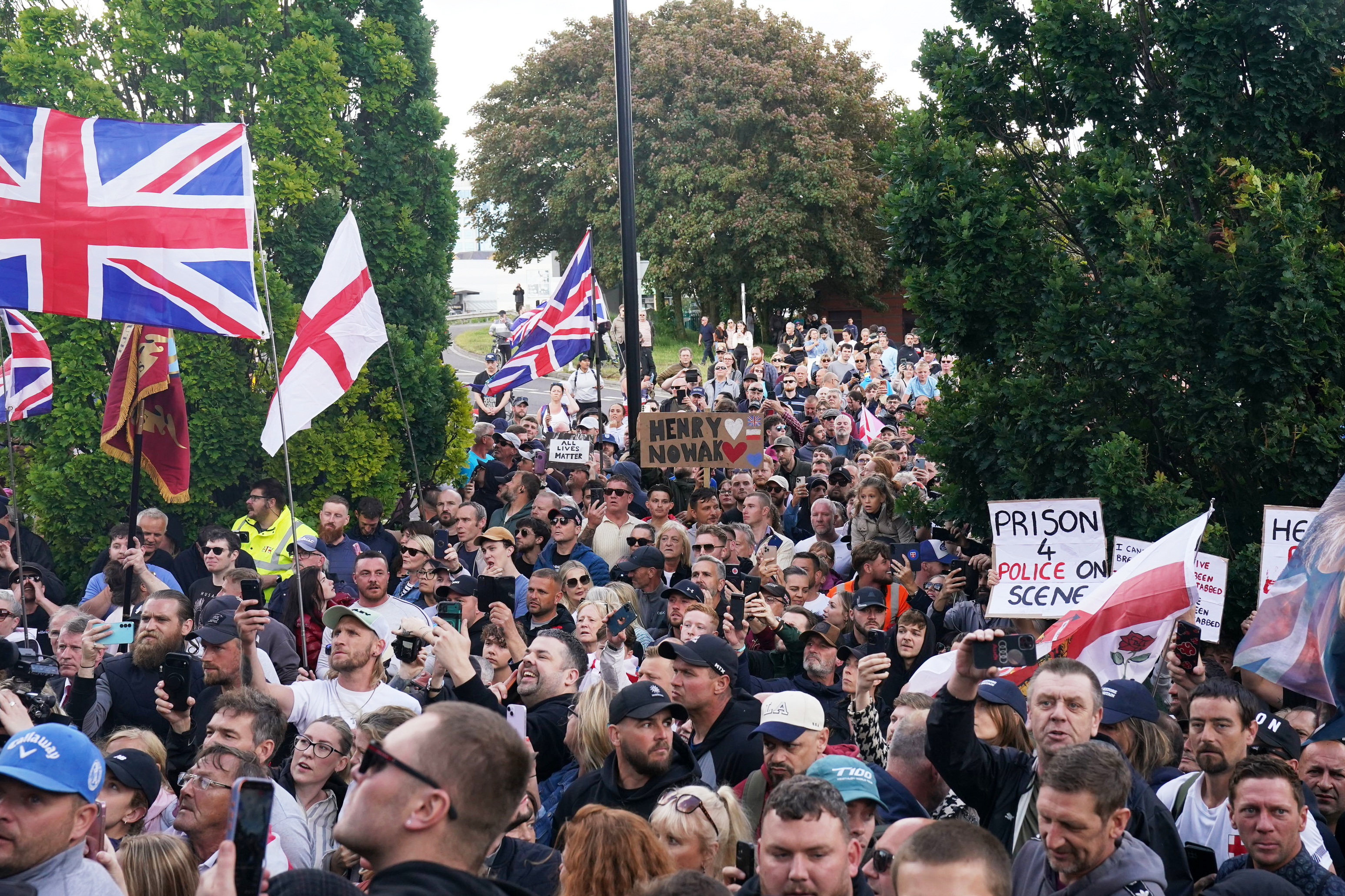 People gather to protest outside Southampton police station, Southampton, England, Tuesday June 2, 2026, after the fatal stabbing of Henry Nowak, a British teenager who was handcuffed despite claiming he was the crime victim