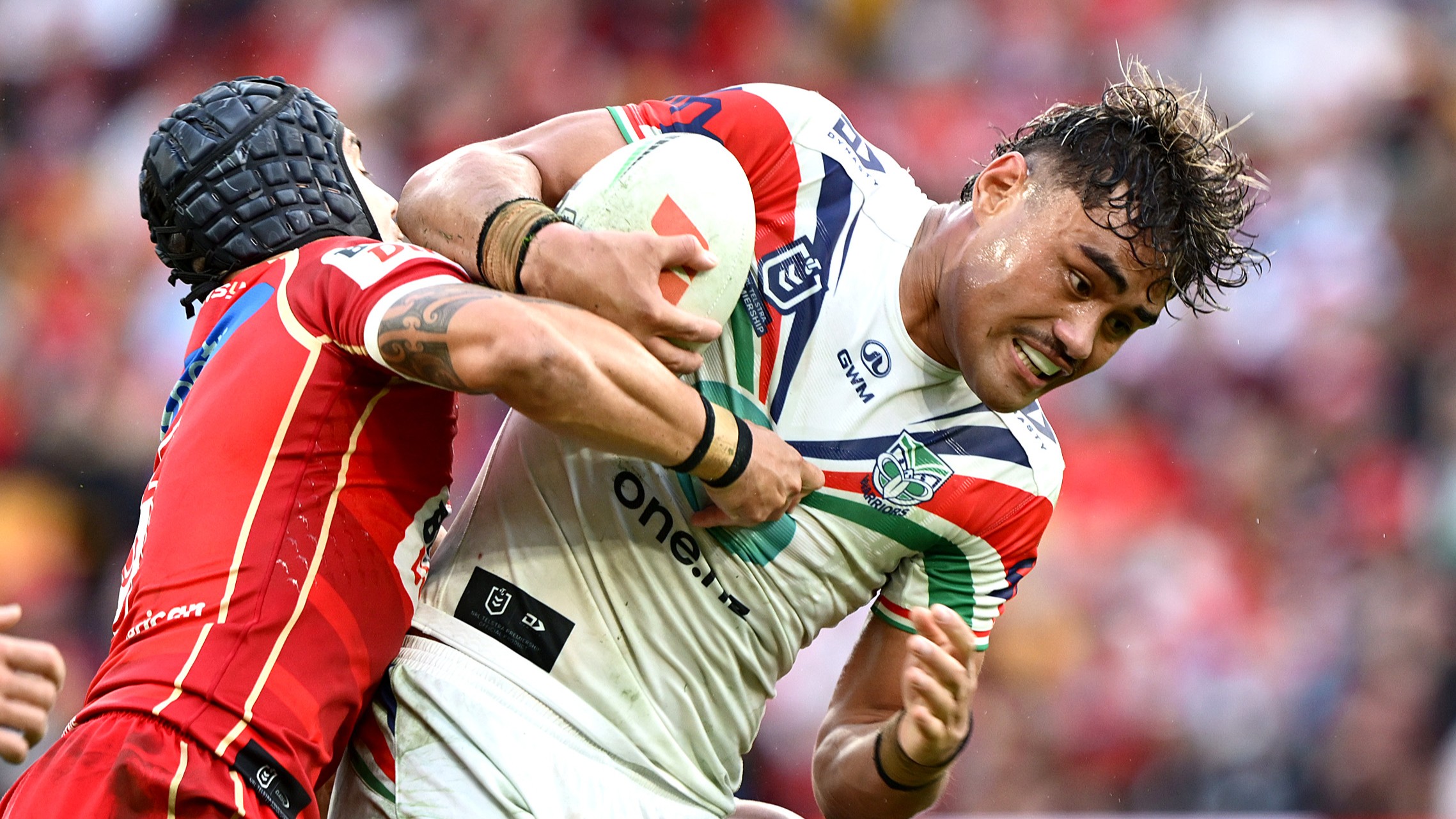 Jacob Laban of the Warriors takes on the defence during the round 17 NRL match between Dolphins and New Zealand Warriors at Suncorp Stadium, on June 27, 2026, in Brisbane, Australia.
